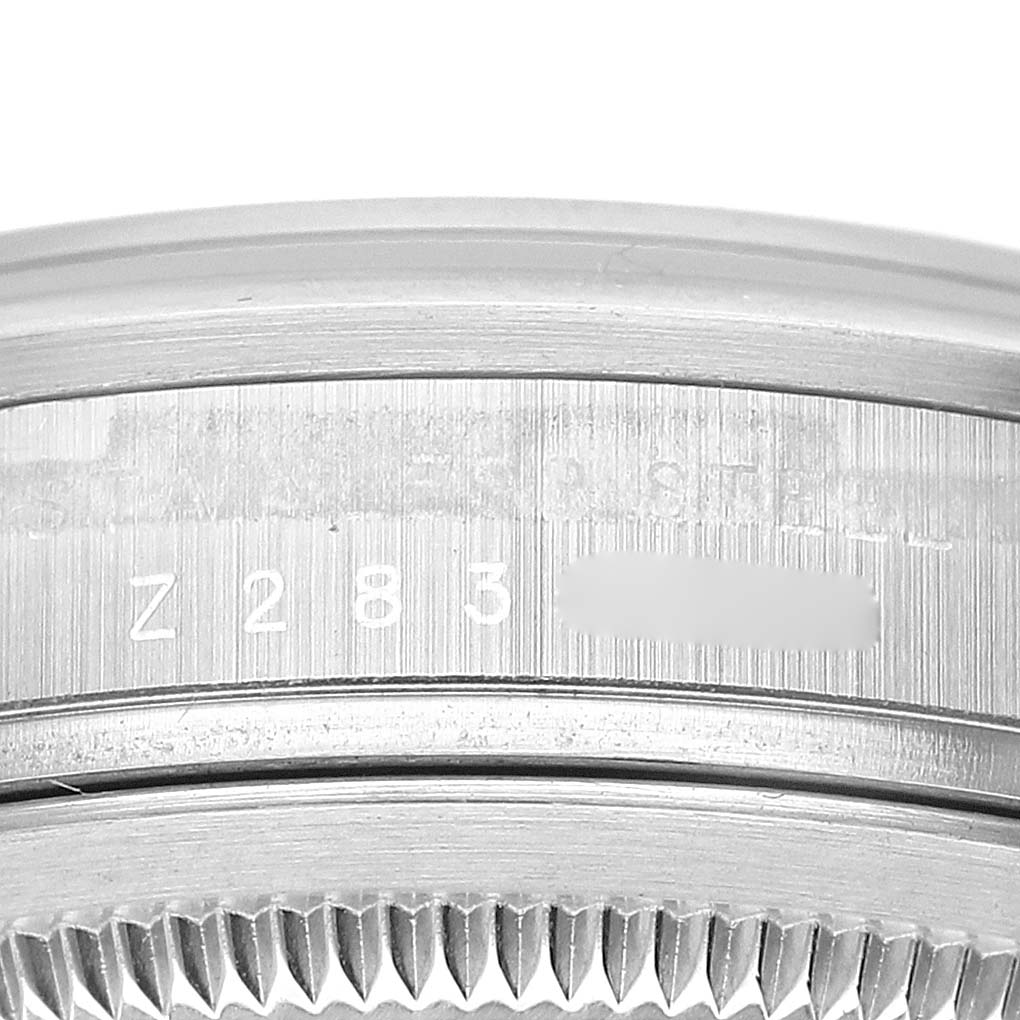 This image shows a close-up of the case side and serial number of a Rolex Explorer 114270 Men
s Stainless Steel Black Dial 114270 Men
s Stainless Steel Black Dial watch.