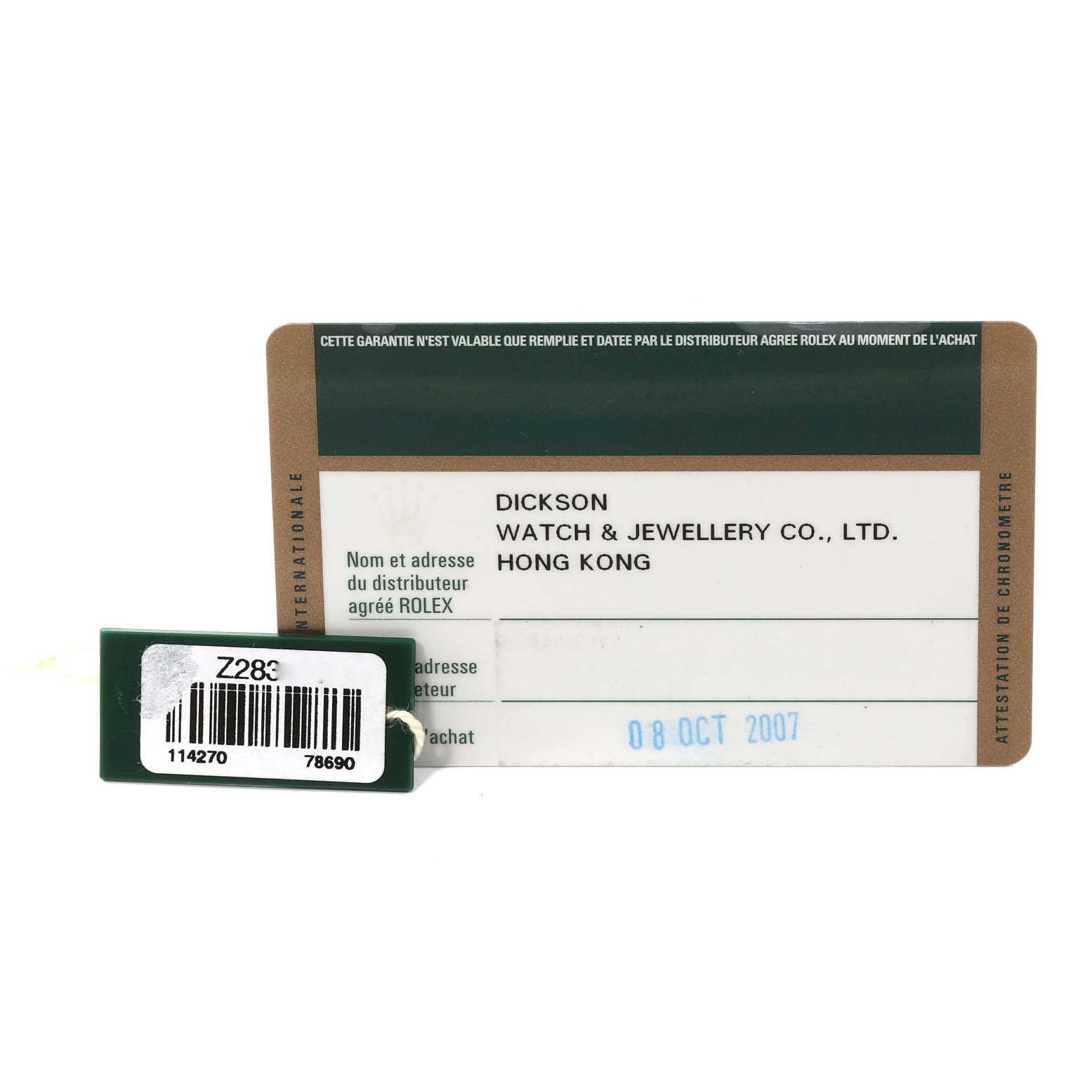 The image shows the warranty card and a hang tag for a Rolex Explorer 114270 Men
s Stainless Steel Black Dial 114270 Men
s Stainless Steel Black Dial watch.