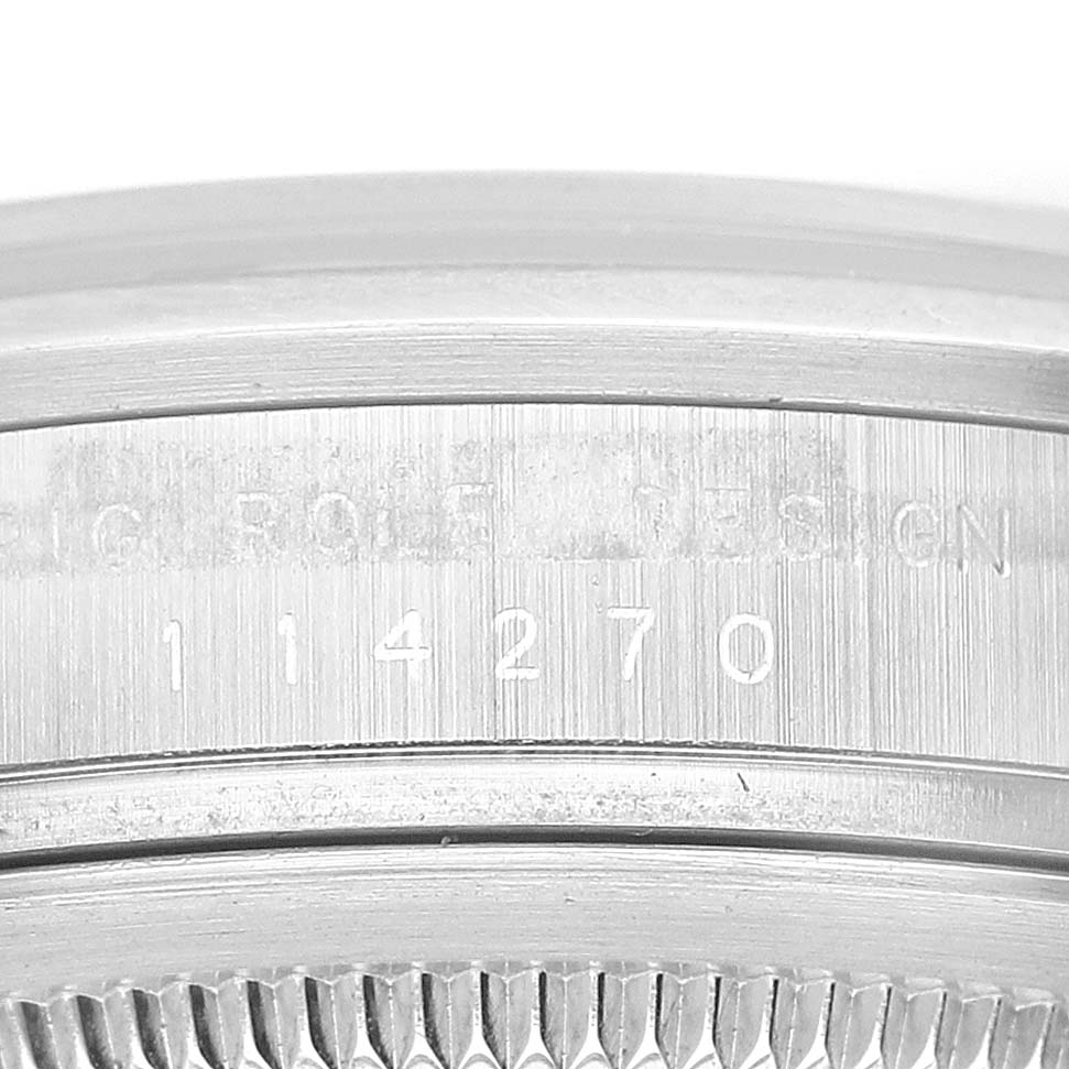 This image shows a close-up of the engraved case side of a Rolex Explorer 114270 Men
s Stainless Steel Black Dial 114270 Men
s Stainless Steel Black Dial model watch.