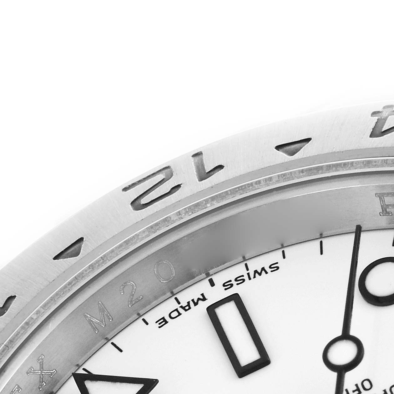 The image shows a close-up of the bezel, dial, and part of the markers of a Rolex Explorer 16570 Men's Stainless Steel White Dial 16570 Men's Stainless Steel White Dial watch.