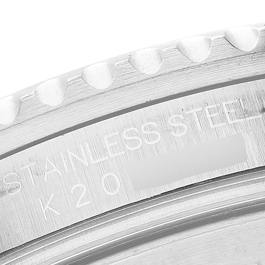 This image shows a close-up of the case back and serial number of a Rolex GMT-Master 16710 Men's Stainless Steel Black Dial 16710 Men's Stainless Steel Black Dial watch made of stainless steel.