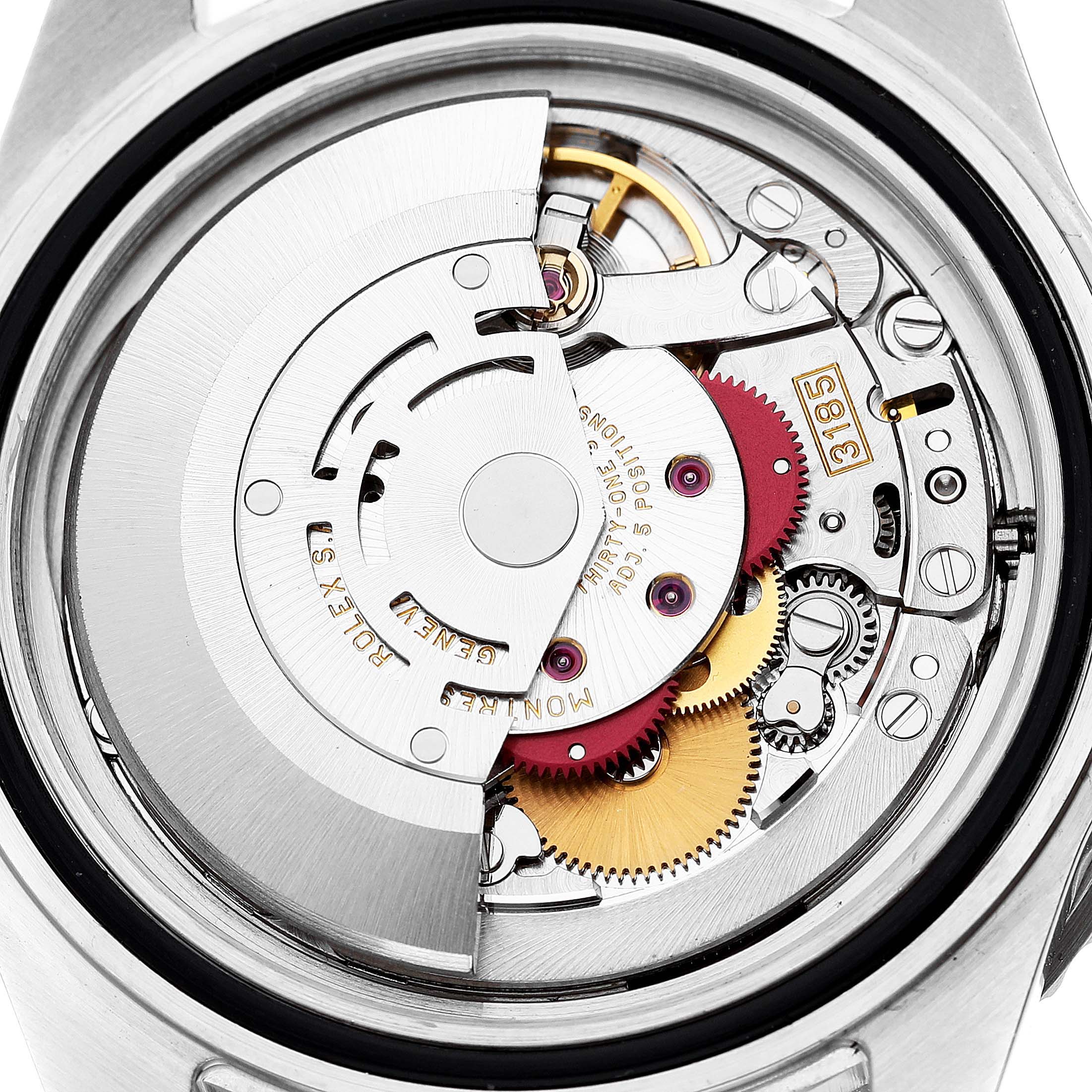 This image shows the movement mechanism of a Rolex GMT-Master 16710 Men's Stainless Steel Black Dial 16710 Men's Stainless Steel Black Dial watch from a rear, close-up angle, highlighting gears and components.