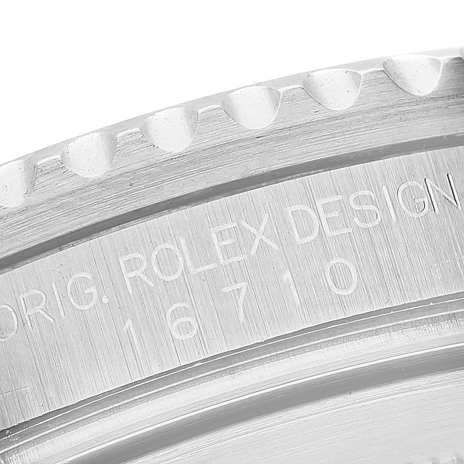 This close-up image shows the side engraving on a Rolex GMT-Master 16710 Men's Stainless Steel Black Dial 16710 Men's Stainless Steel Black Dial, model 16710.