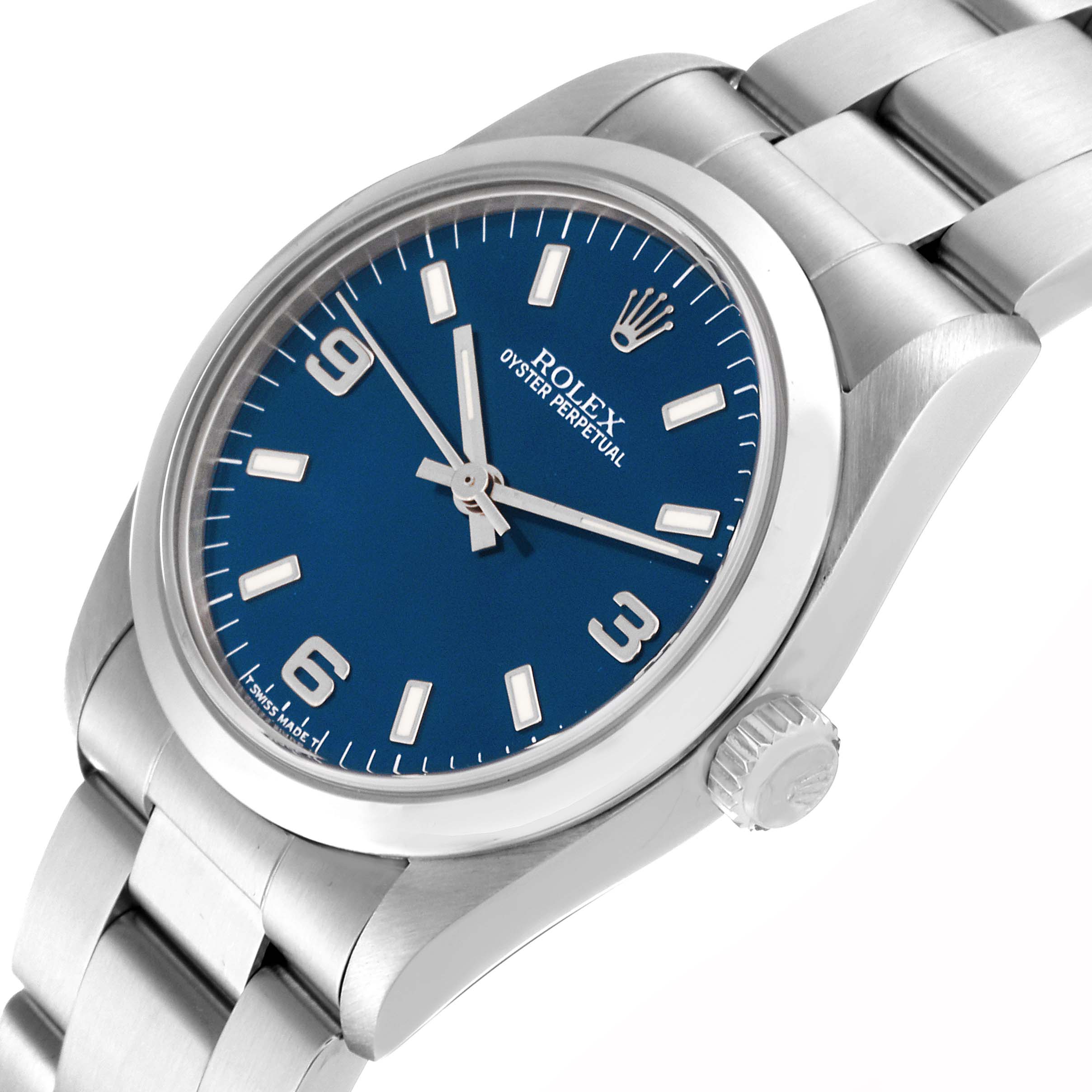 The image shows a side-angle view of the Rolex Mid-Size 67480 Women
s Stainless Steel Blue Dial 67480 Women
s Stainless Steel Blue Dial Oyster Perpetual watch, featuring its blue dial, bezel, crown, and part of the bracelet.