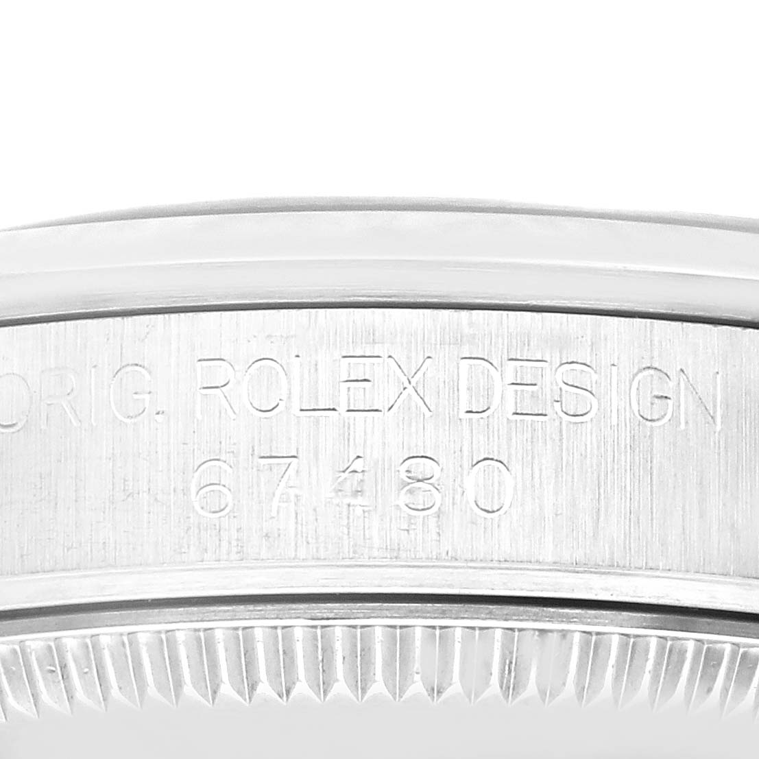 This image shows a close-up view of the case side engraving of a Mid-Size model Rolex watch, highlighting "ORIG. ROLEX DESIGN 67480".