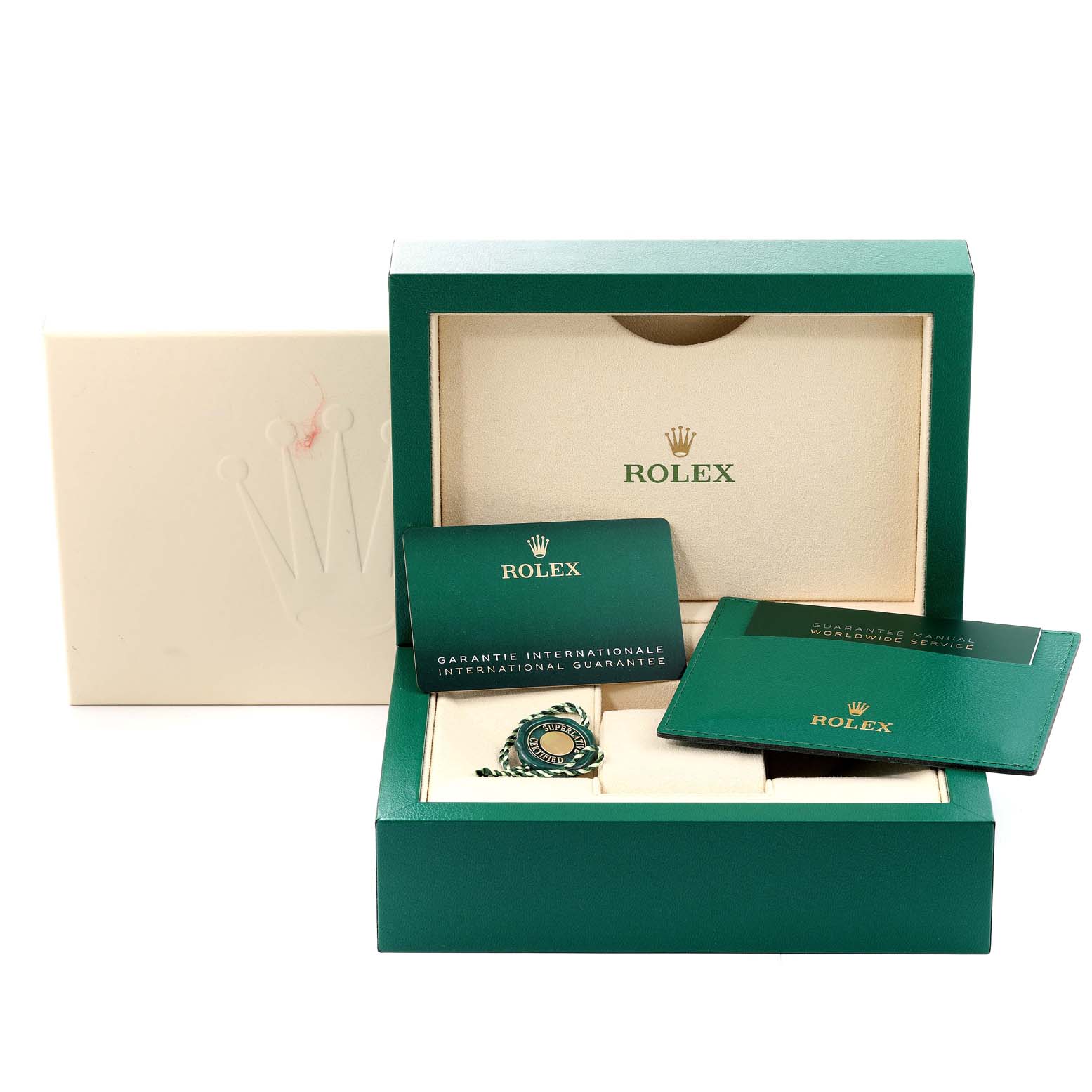 The image shows the packaging, international guarantee manual, and certificate for a Rolex Milgauss 116400GV Men
s Stainless Steel Blue Dial 116400GV Men
s Stainless Steel Blue Dial watch from a front angle.