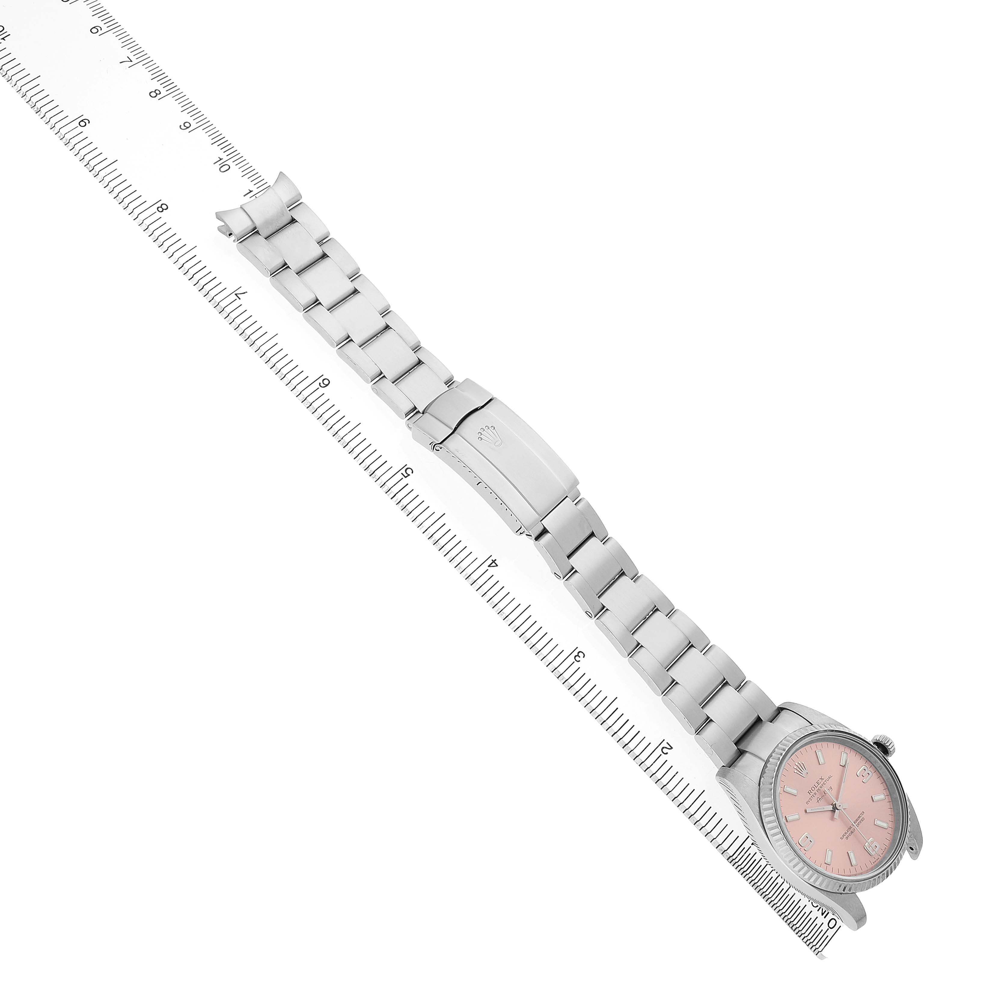 The image shows a Rolex Air-King 114234 Men's Stainless Steel Pink Dial watch from an overhead angle, highlighting its full bracelet and clasp, along with the watch face.