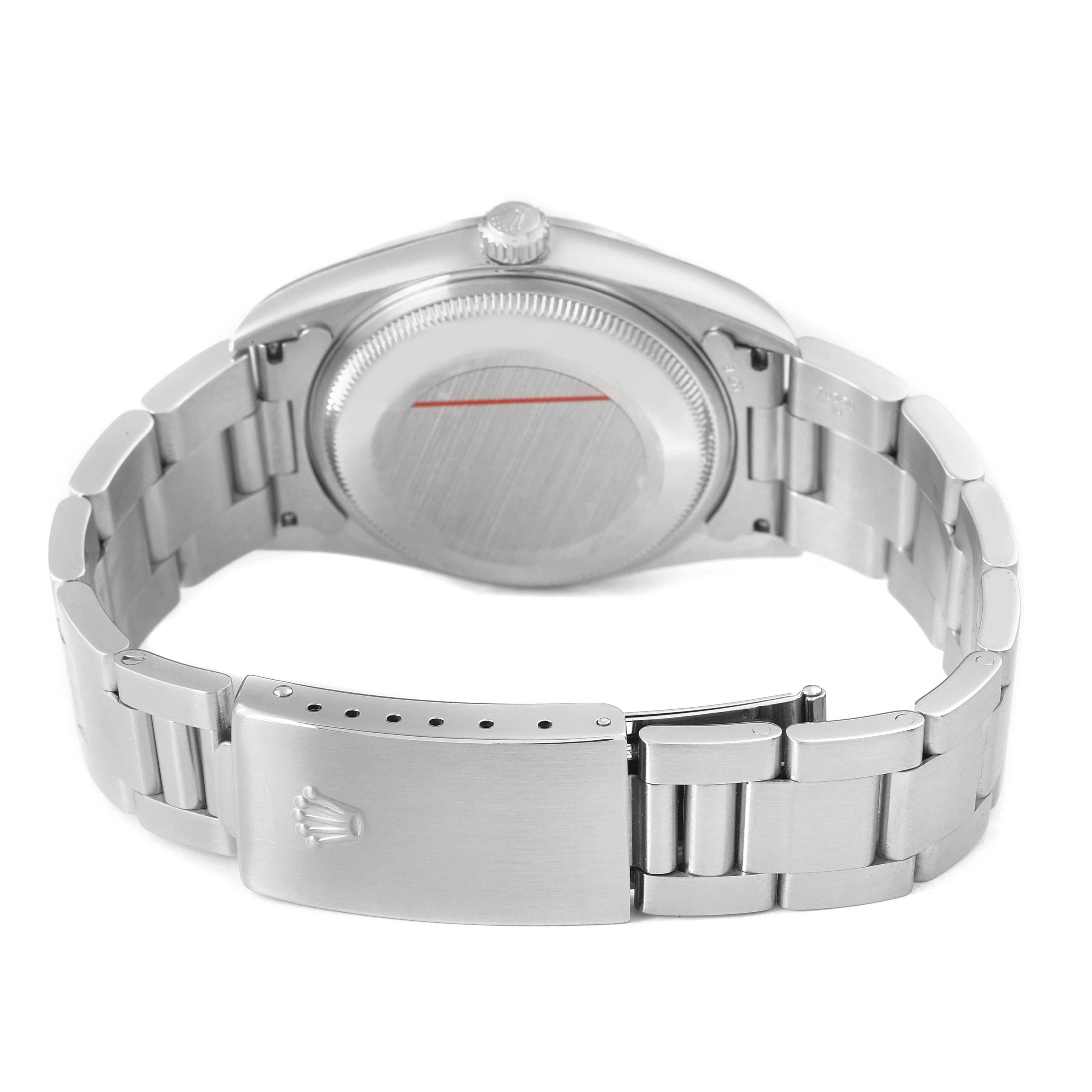 The image shows the back of a Rolex Date 15200 Men's Stainless Steel Silver Dial watch, highlighting the case back, bracelet, and clasp.