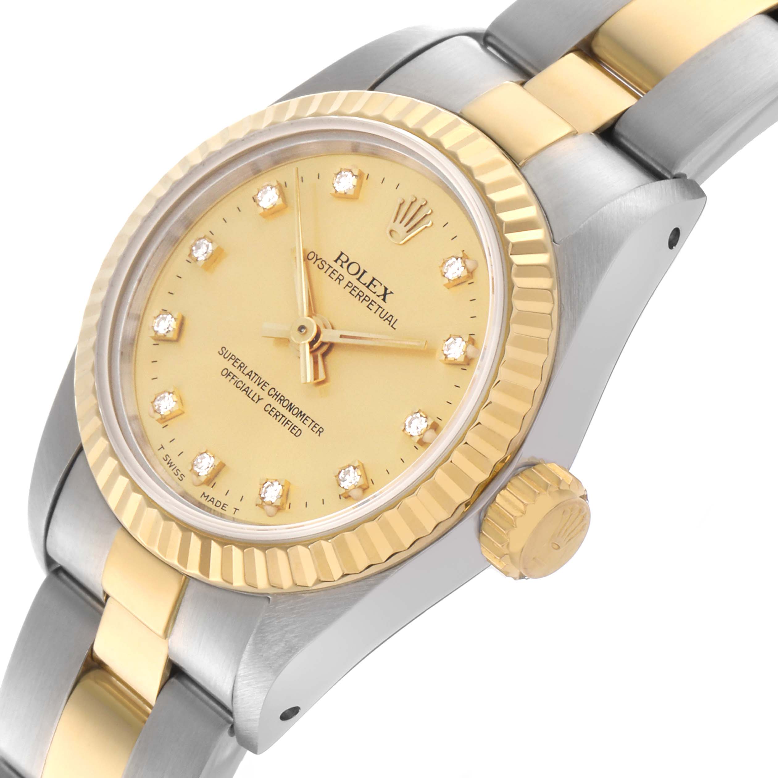 The Rolex Oyster Perpetual 67193 Women's Steel and Gold (two tone) Champagne Dial 67193 Women's Steel and Gold (two tone) Champagne Dial watch is shown at an oblique angle, displaying the face, crown, and bracelet.