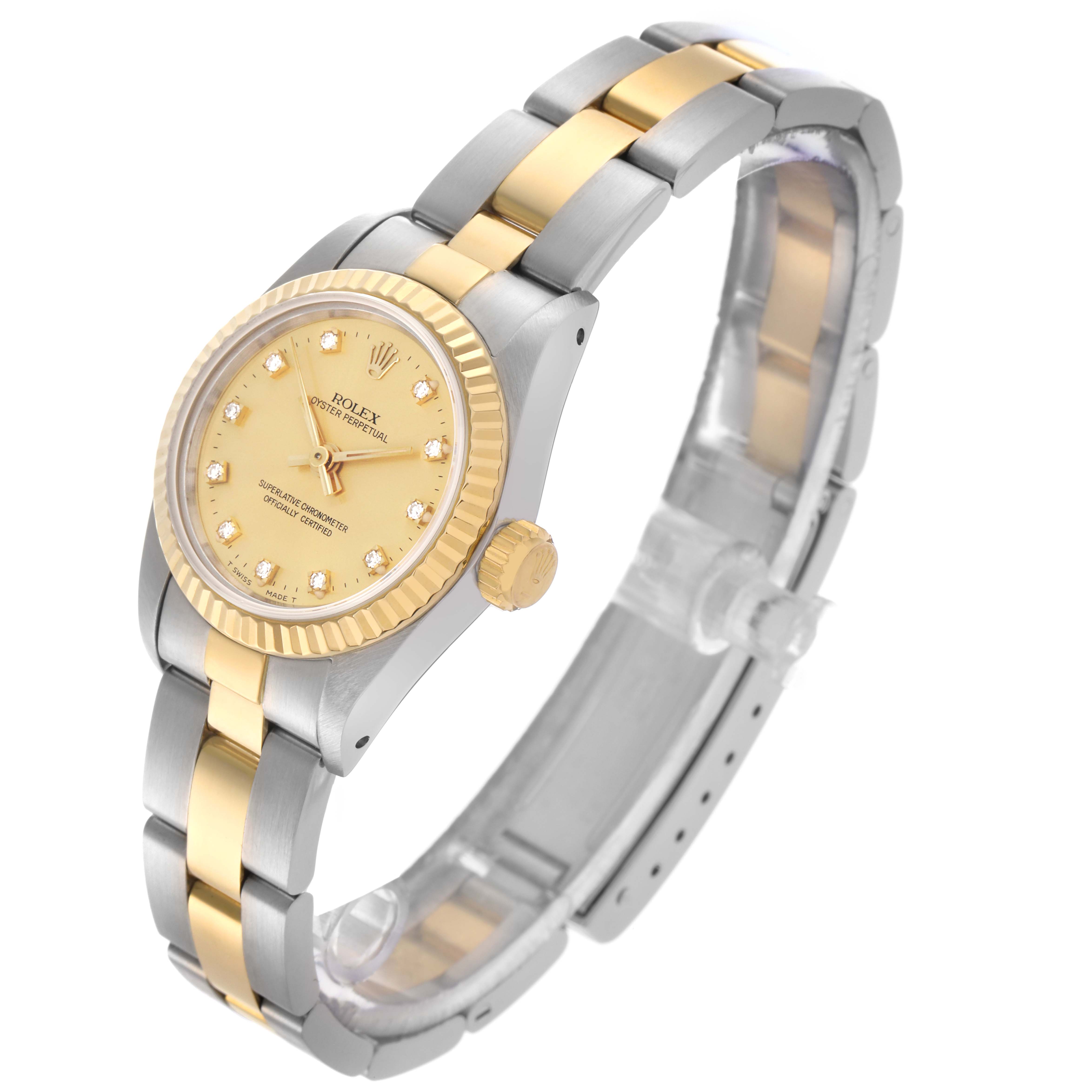 The Rolex Oyster Perpetual 67193 Women's Steel and Gold (two tone) Champagne Dial 67193 Women's Steel and Gold (two tone) Champagne Dial watch is shown at a three-quarter angle, highlighting its gold and silver bracelet, bezel, and crown.