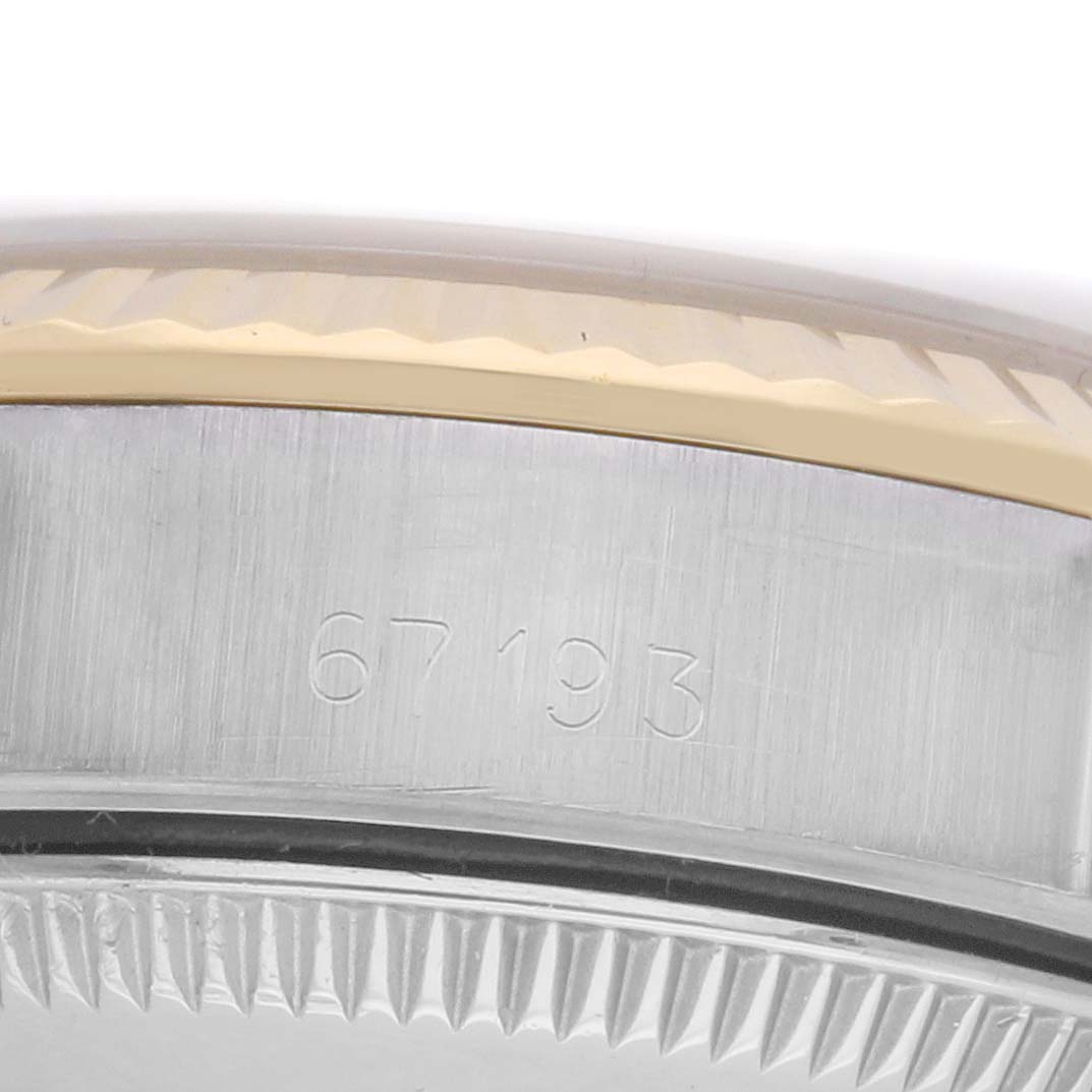 The image shows a close-up of the side of a Rolex Oyster Perpetual 67193 Women's Steel and Gold (two tone) Champagne Dial 67193 Women's Steel and Gold (two tone) Champagne Dial, focusing on the case edge and bezel.