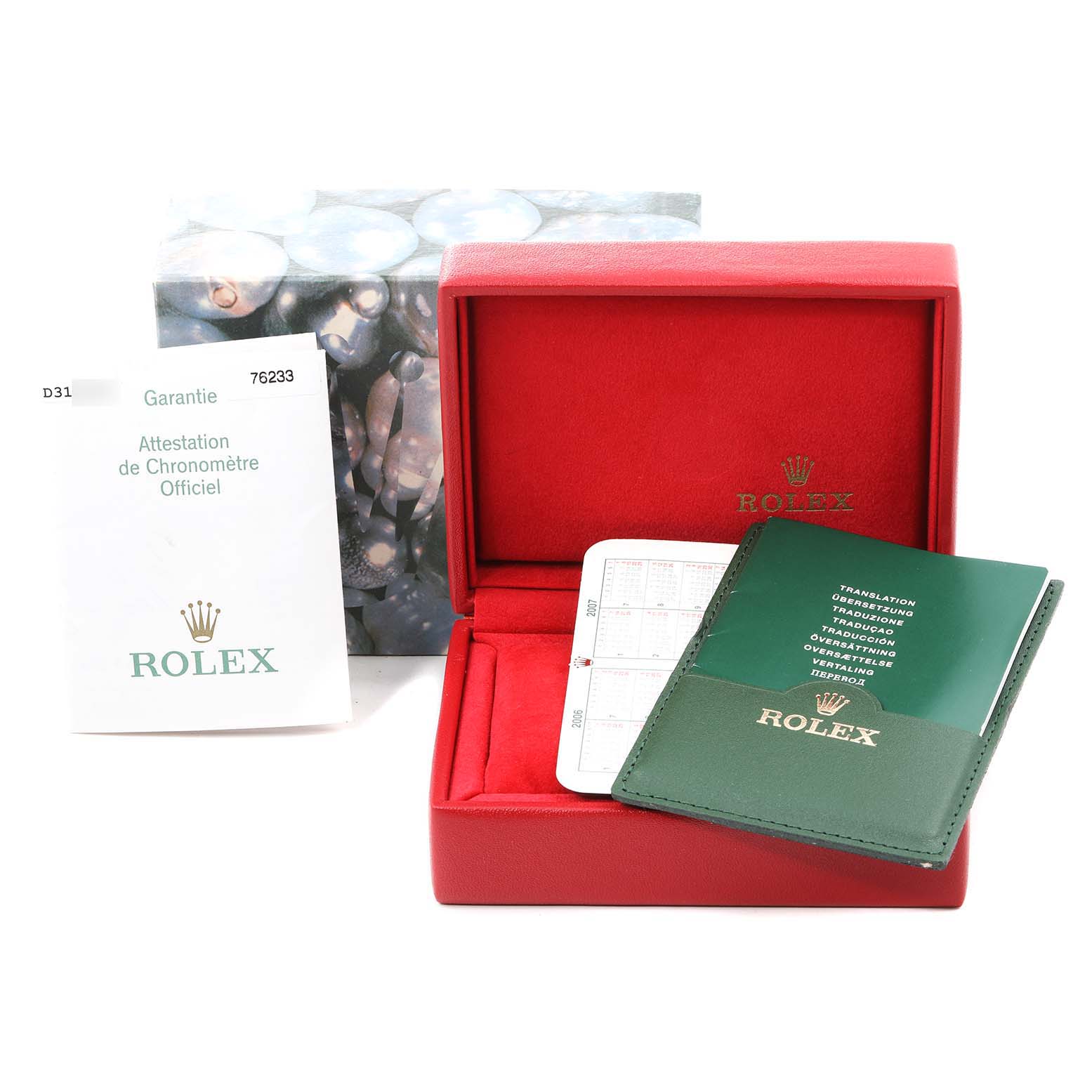 This image shows a Rolex Oyster Perpetual 76233 Women's Steel and Gold (two tone) Black Dial 76233 Women's Steel and Gold (two tone) Black Dial watch box, warranty card, manual, and official chronometer certification.