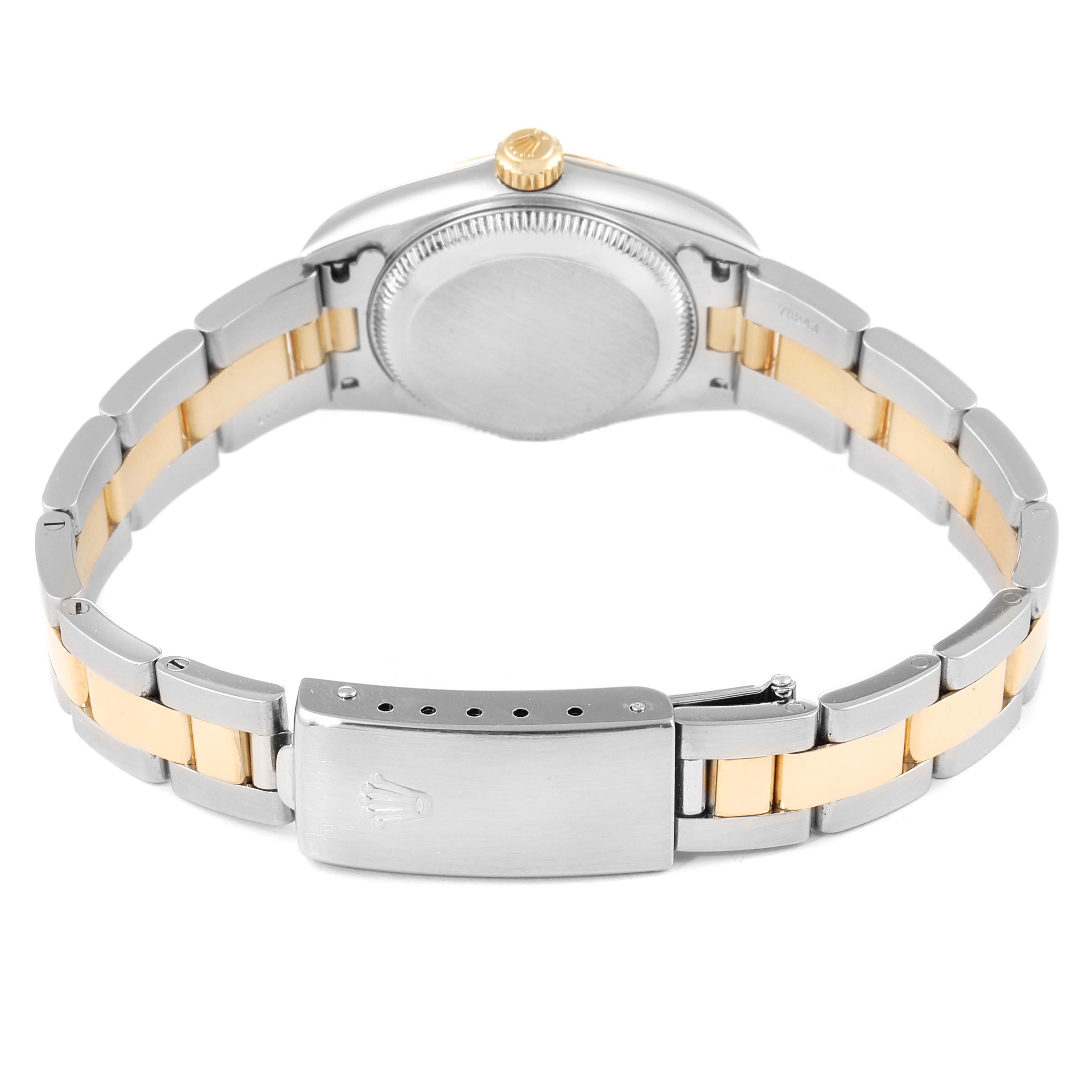 The image shows the back view of a Rolex Oyster Perpetual 76233 Women's Steel and Gold (two tone) Black Dial 76233 Women's Steel and Gold (two tone) Black Dial watch, highlighting the clasp, bracelet, and case back.