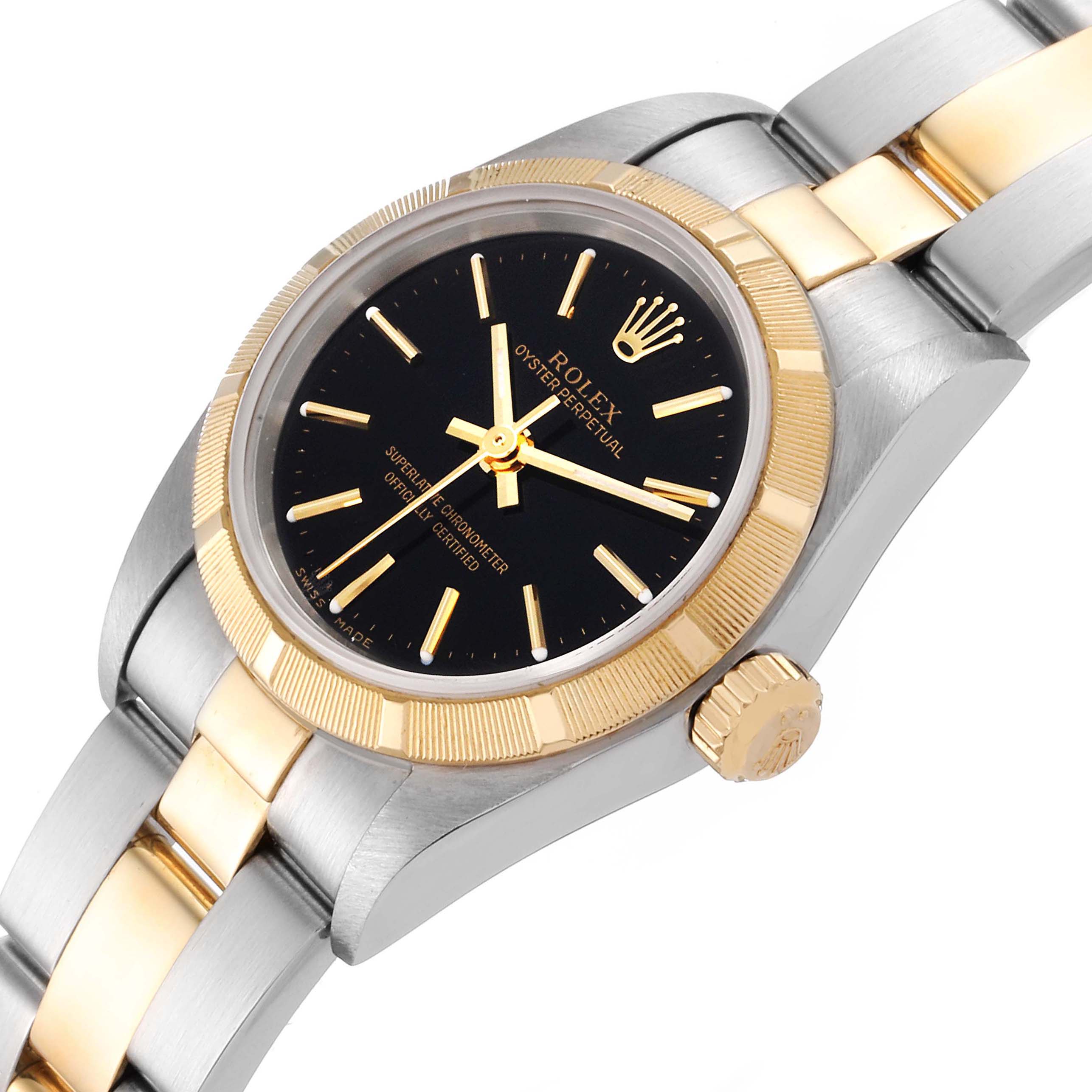 This image shows a Rolex Oyster Perpetual 76233 Women's Steel and Gold (two tone) Black Dial 76233 Women's Steel and Gold (two tone) Black Dial watch at an angled close-up, highlighting the face, bezel, crown, and bracelet.