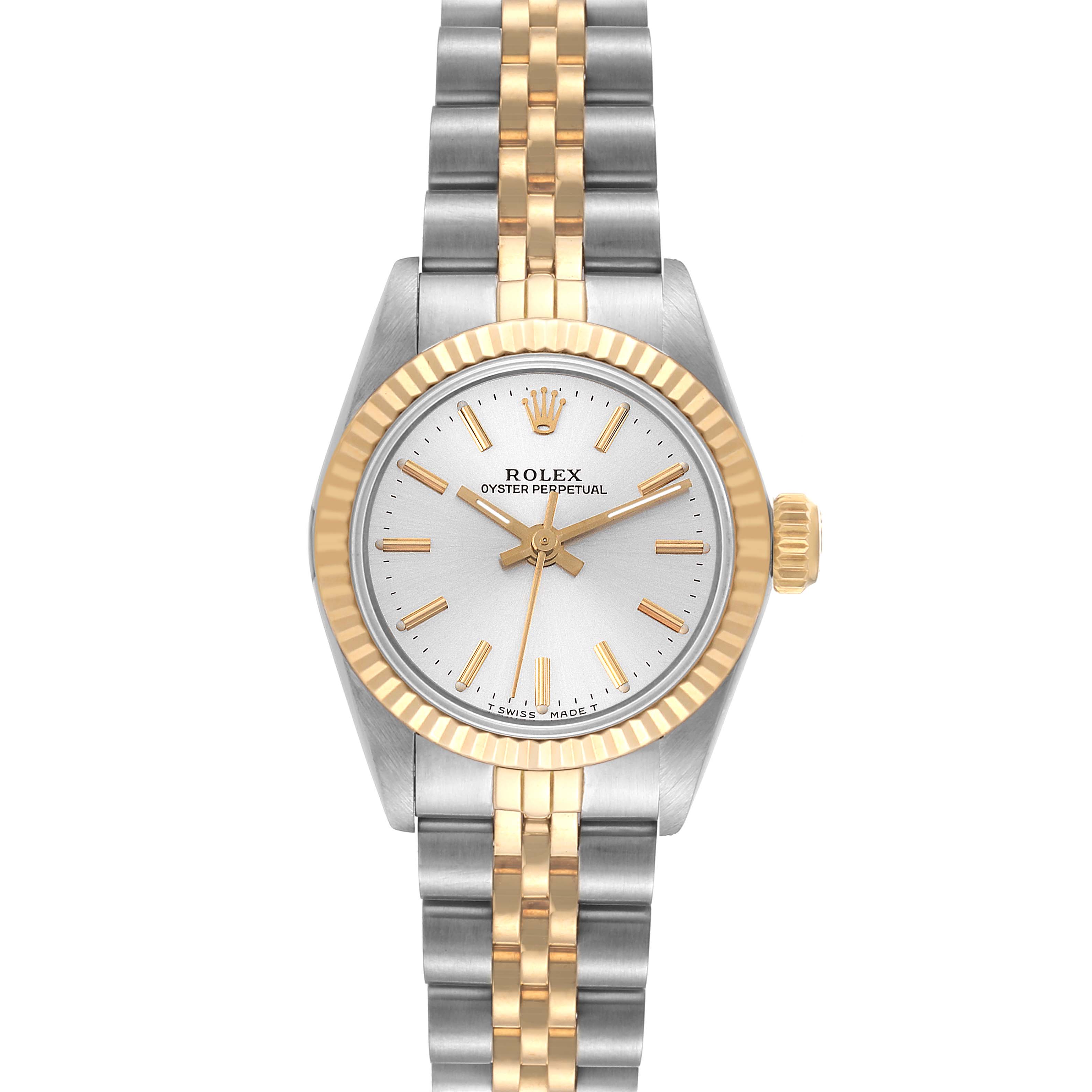 This Rolex Oyster Perpetual 67193 Women's Steel and Gold (two tone) Silver Dial 67193 Women's Steel and Gold (two tone) Silver Dial model is shown from a top-down angle, displaying the face and part of the two-tone band.