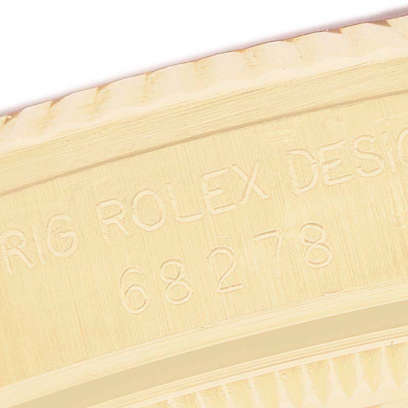 The image shows a close-up of the inner case engraving for a Rolex President 68278 Women's Yellow Gold Blue Dial model, displaying the model number and "ROLEX DESIGN."