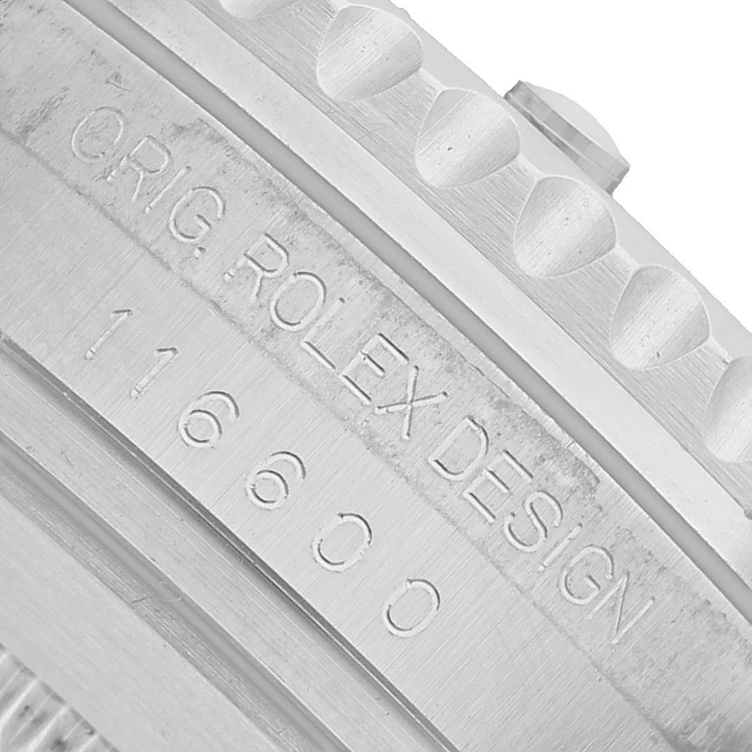 The image shows a close-up of the side of the Rolex Sea-Dweller 116600 Men's Stainless Steel Black Dial, focusing on the engraving and part of the bezel.