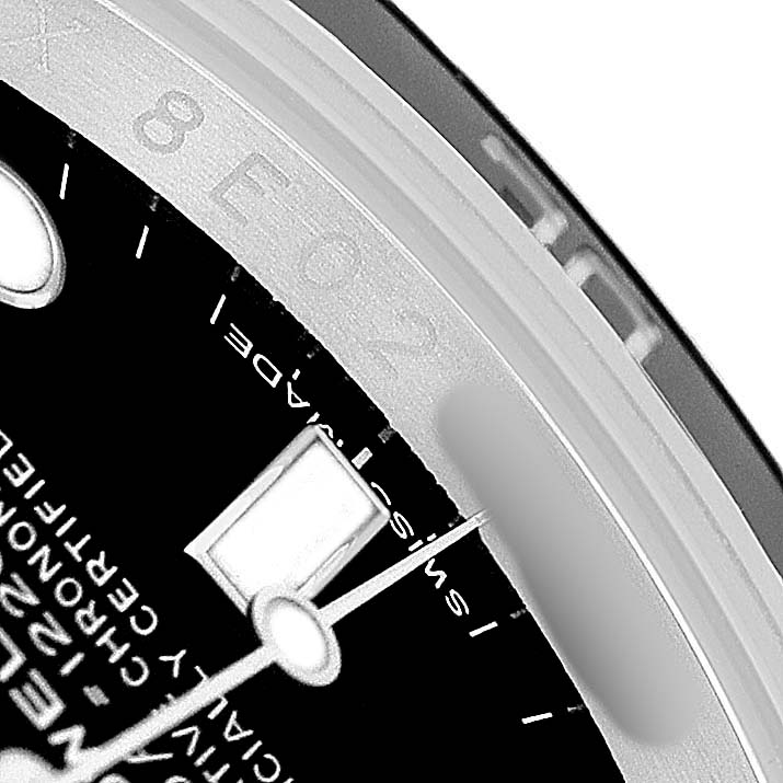 The image shows a close-up of the Rolex Sea-Dweller 116600 Men's Stainless Steel Black Dial's bezel and dial, featuring part of the logo, markers, and hands.