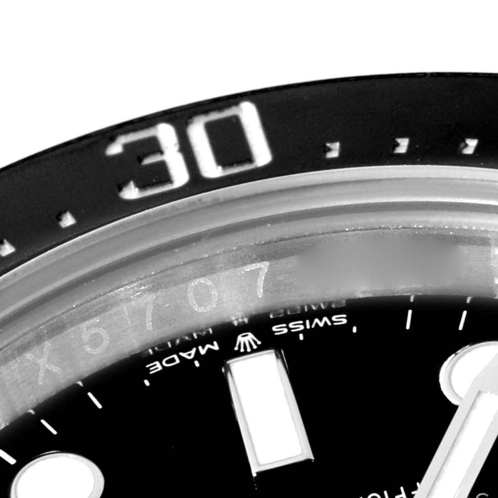 The image shows a close-up of the bezel and part of the dial of a Rolex Sea-Dweller 126600 Men's Stainless Steel Black Dial 126600 Men's Stainless Steel Black Dial watch, highlighting the "30" minute marker.