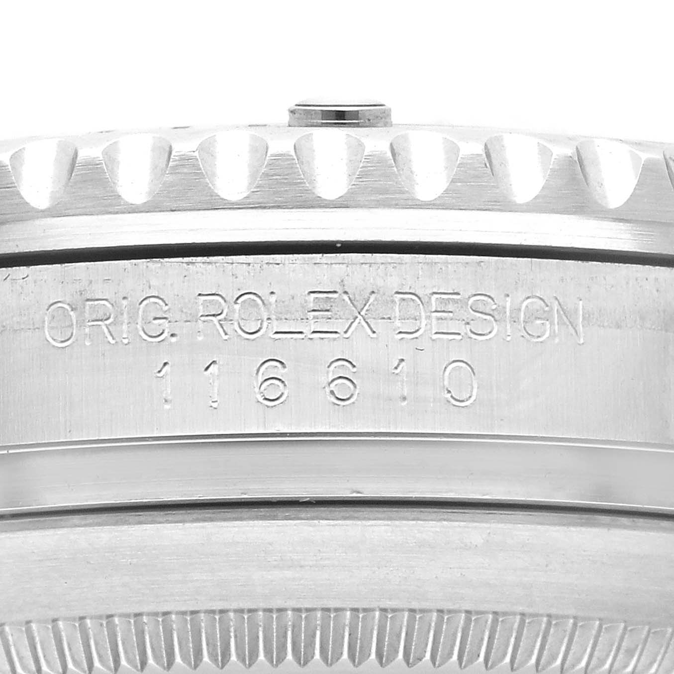 The image shows a close-up angle of the case side of a Rolex Submariner 116610LV Men's Stainless Steel Green Dial 116610LV Men's Stainless Steel Green Dial, revealing the model number 116610 and "ORIG. ROLEX DESIGN" engraving.