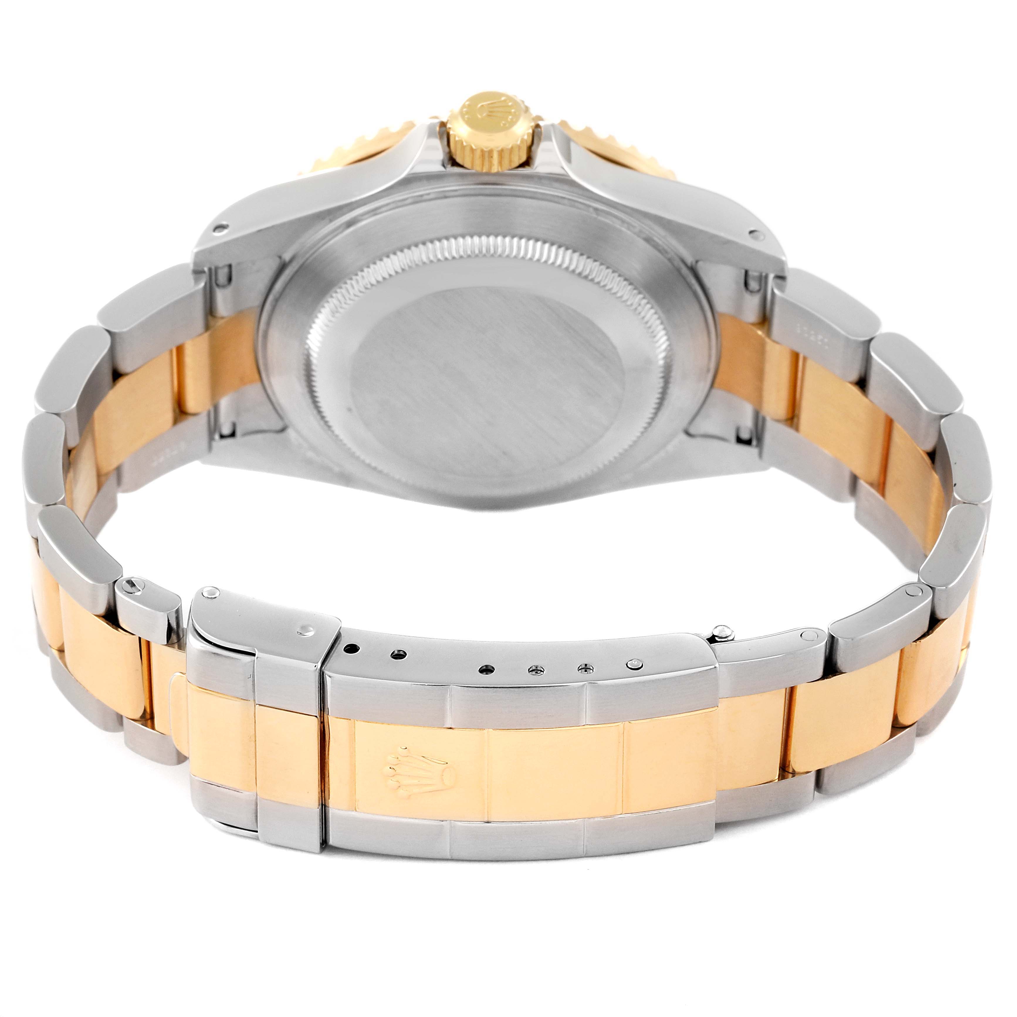 The image shows the back view of a Rolex Submariner 16613 Men's Steel and Gold (two tone) Champagne Dial 16613 Men's Steel and Gold (two tone) Champagne Dial's case and two-tone bracelet clasp.