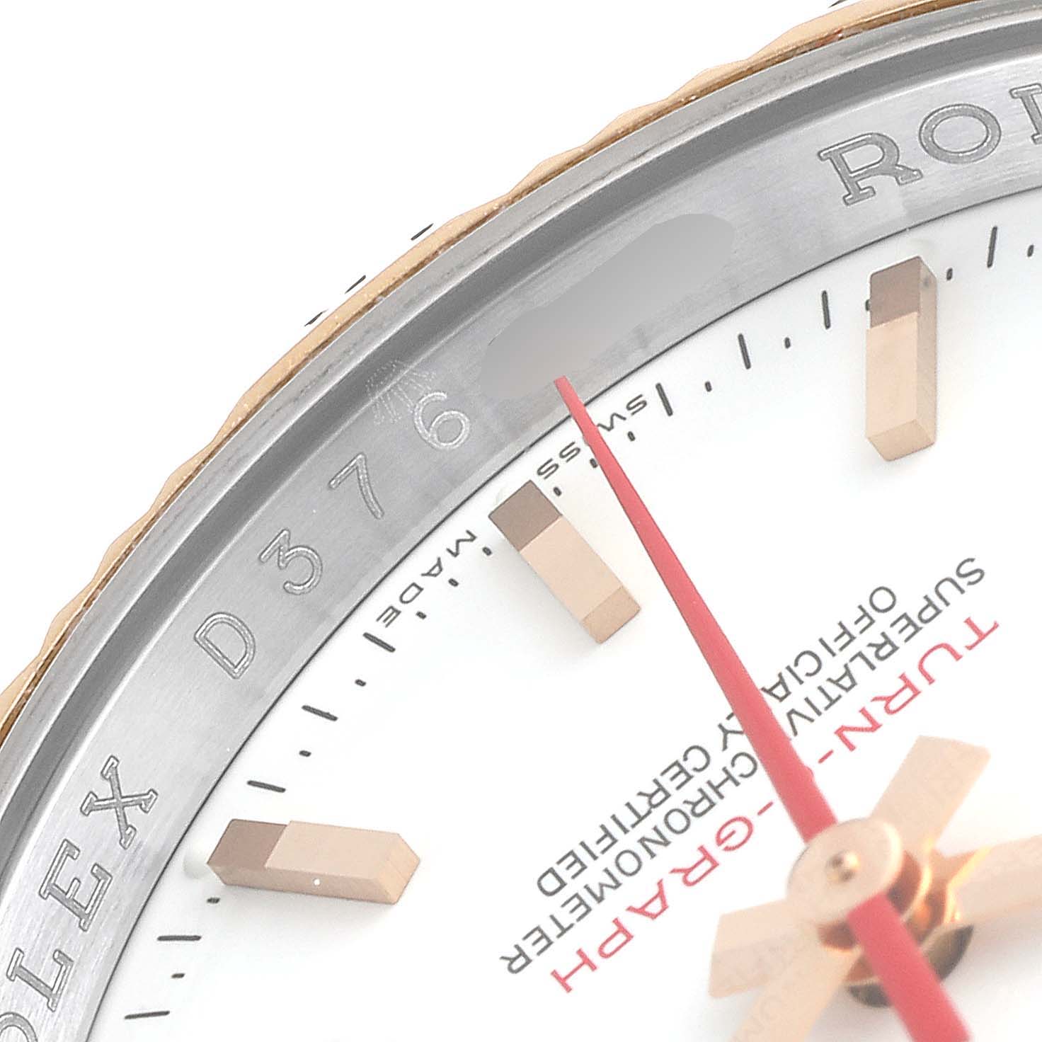 This image shows a close-up of the dial, bezel, and part of the second hand of the Rolex Turn-o-Graph 116261 Men's Steel and Gold (two tone) White Dial 116261 Men's Steel and Gold (two tone) White Dial watch.