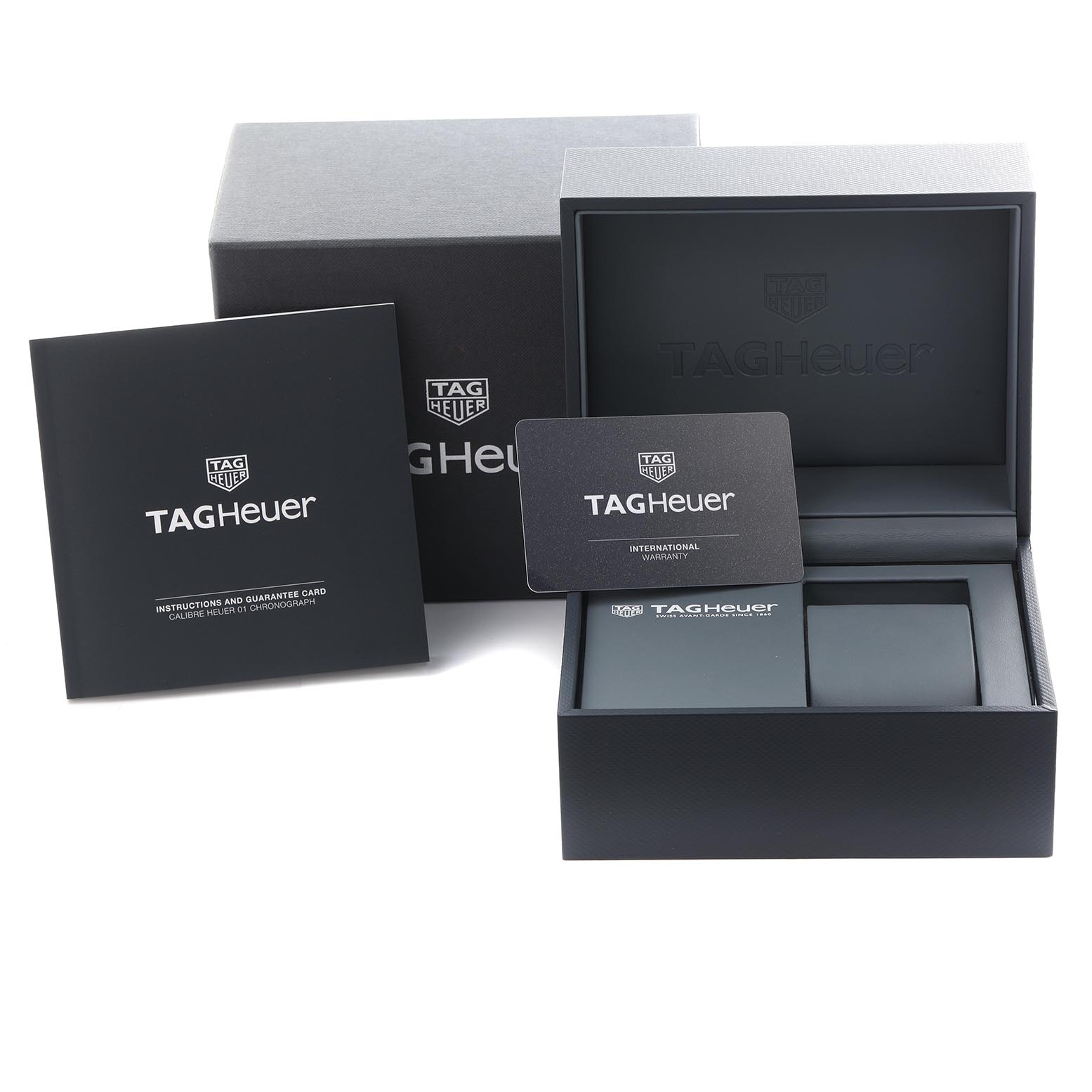 The image shows the packaging, warranty card, and booklet for a Tag Heuer Carrera CAR201T.BA0766 Men's Stainless Steel Blue Dial CAR201T.BA0766 Men's Stainless Steel Blue Dial watch.