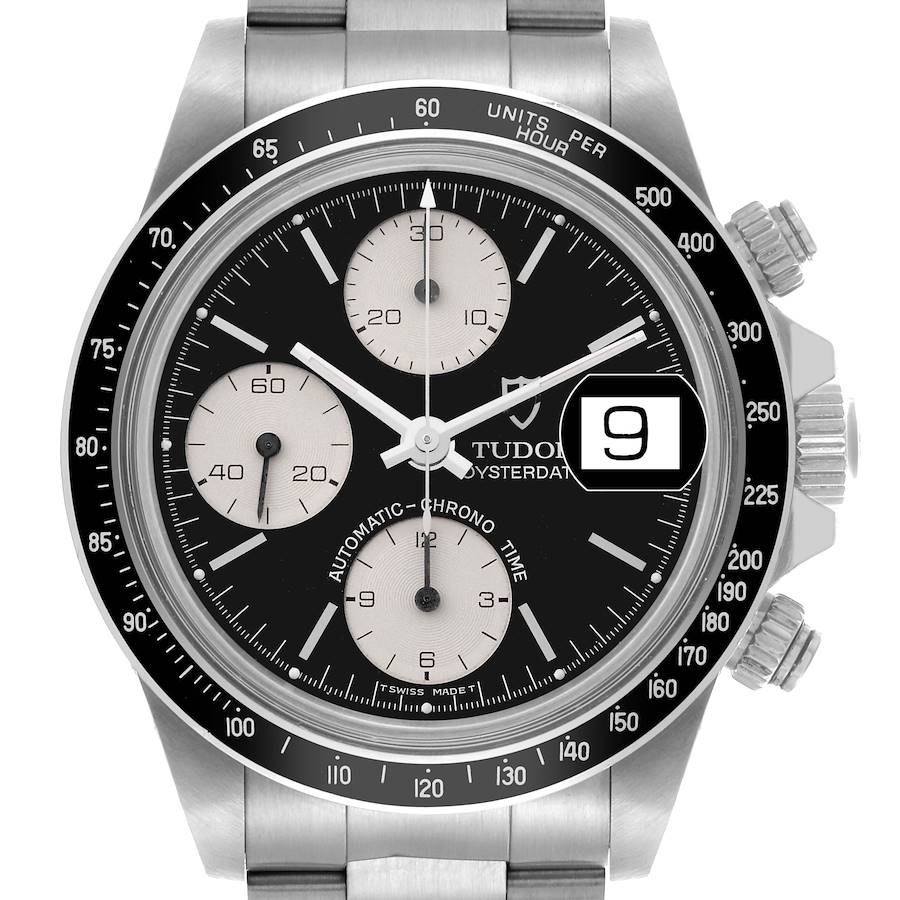 The Tudor Big Block watch is shown from the front, highlighting the bezel, face, sub-dials, and crown.