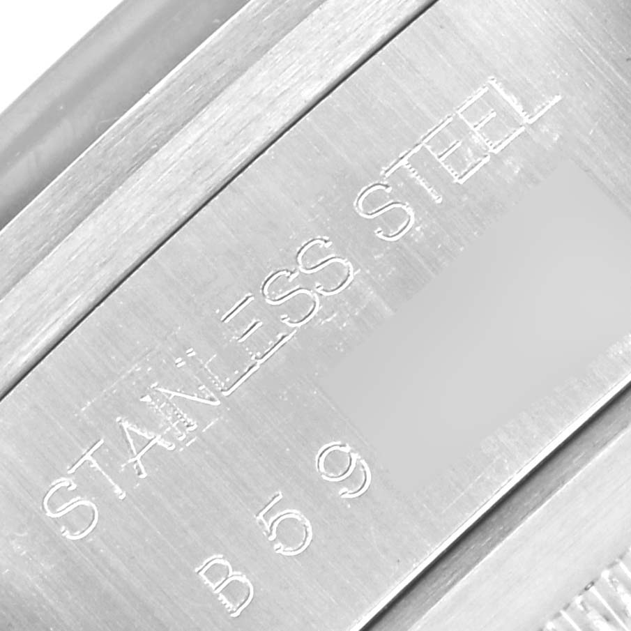 The image shows an angled close-up of the stainless steel case back of a Tudor Big Block 79160 Men's Stainless Steel Black Dial 79160 Men's Stainless Steel Black Dial watch, highlighting engraved text.