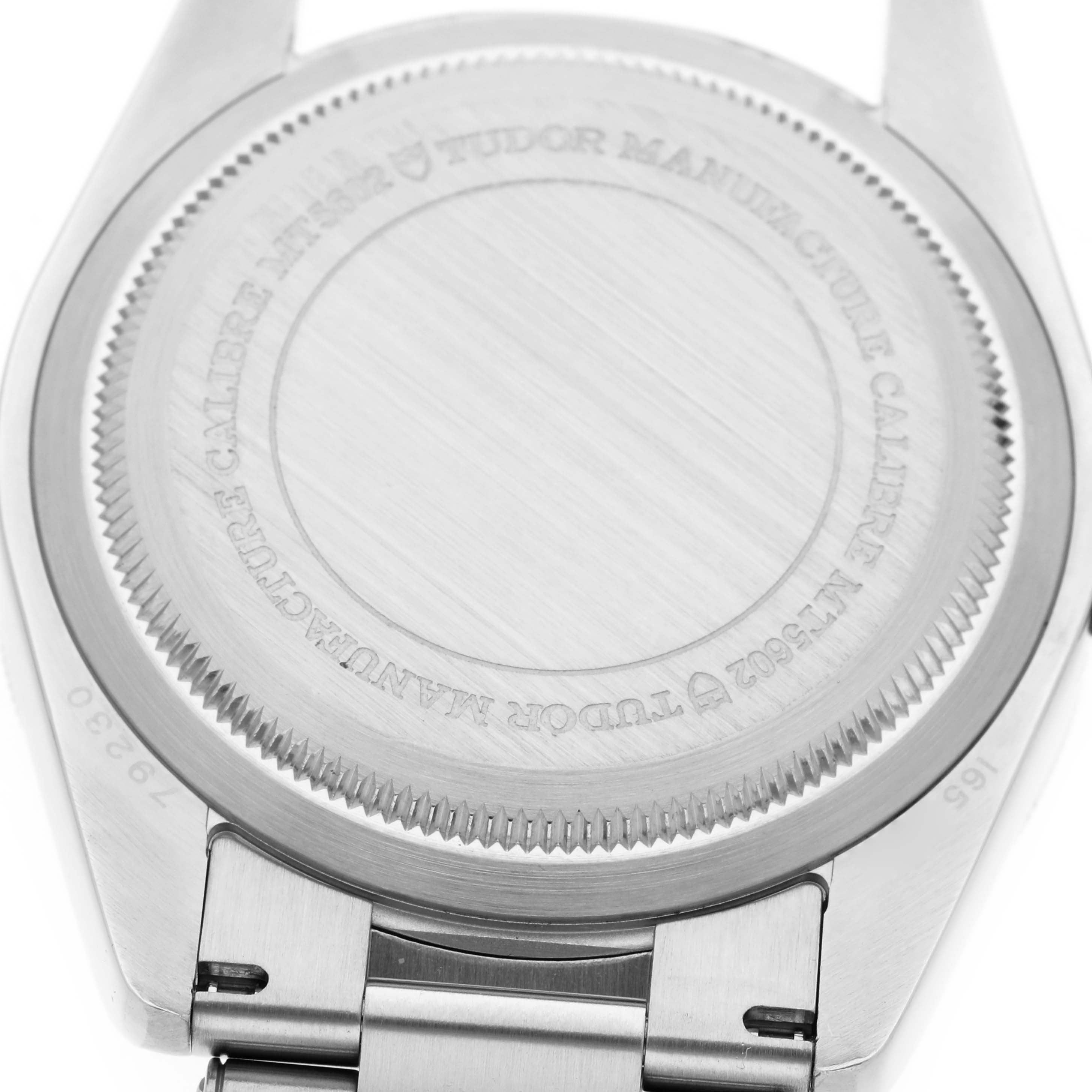 The image shows the back of the Tudor Heritage Black Bay 79230N Men's Stainless Steel Black Dial 79230N Men's Stainless Steel Black Dial watch, highlighting its case back and bracelet attachment.