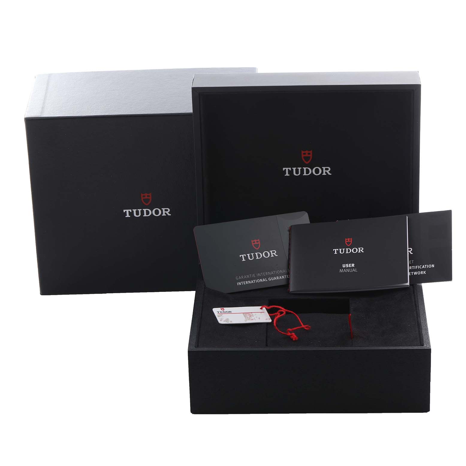 The image shows the packaging and documentation for a Tudor Heritage Black Bay 70150 Men's Stainless Steel Black Dial 70150 Men's Stainless Steel Black Dial watch, including boxes and user manuals.
