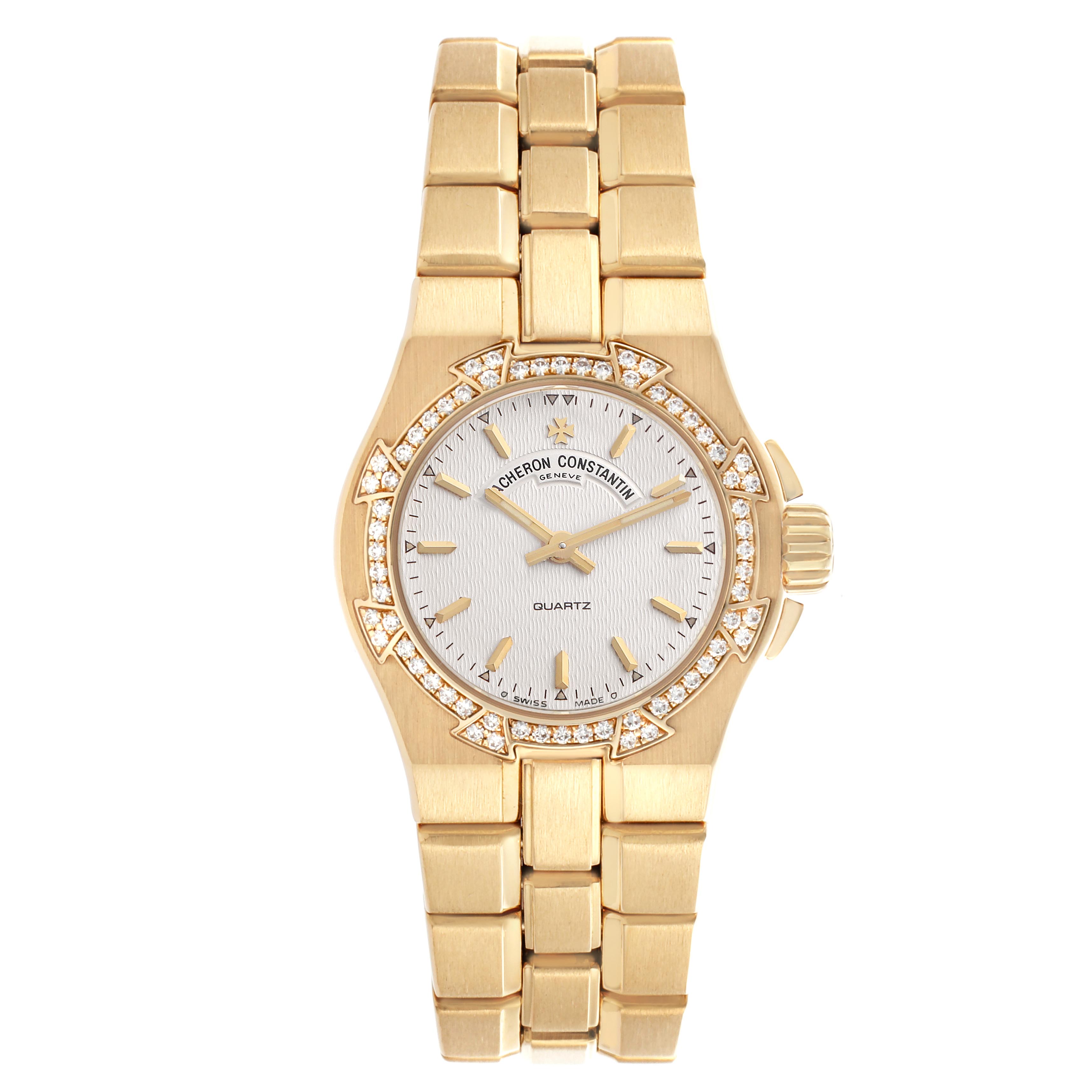 The Vacheron Constantin Overseas 16550.423J Women's Yellow Gold Silver Dial 16550.423J Women's Yellow Gold Silver Dial watch is shown from a top-down angle, displaying its gold case, bracelet, and diamond bezel.