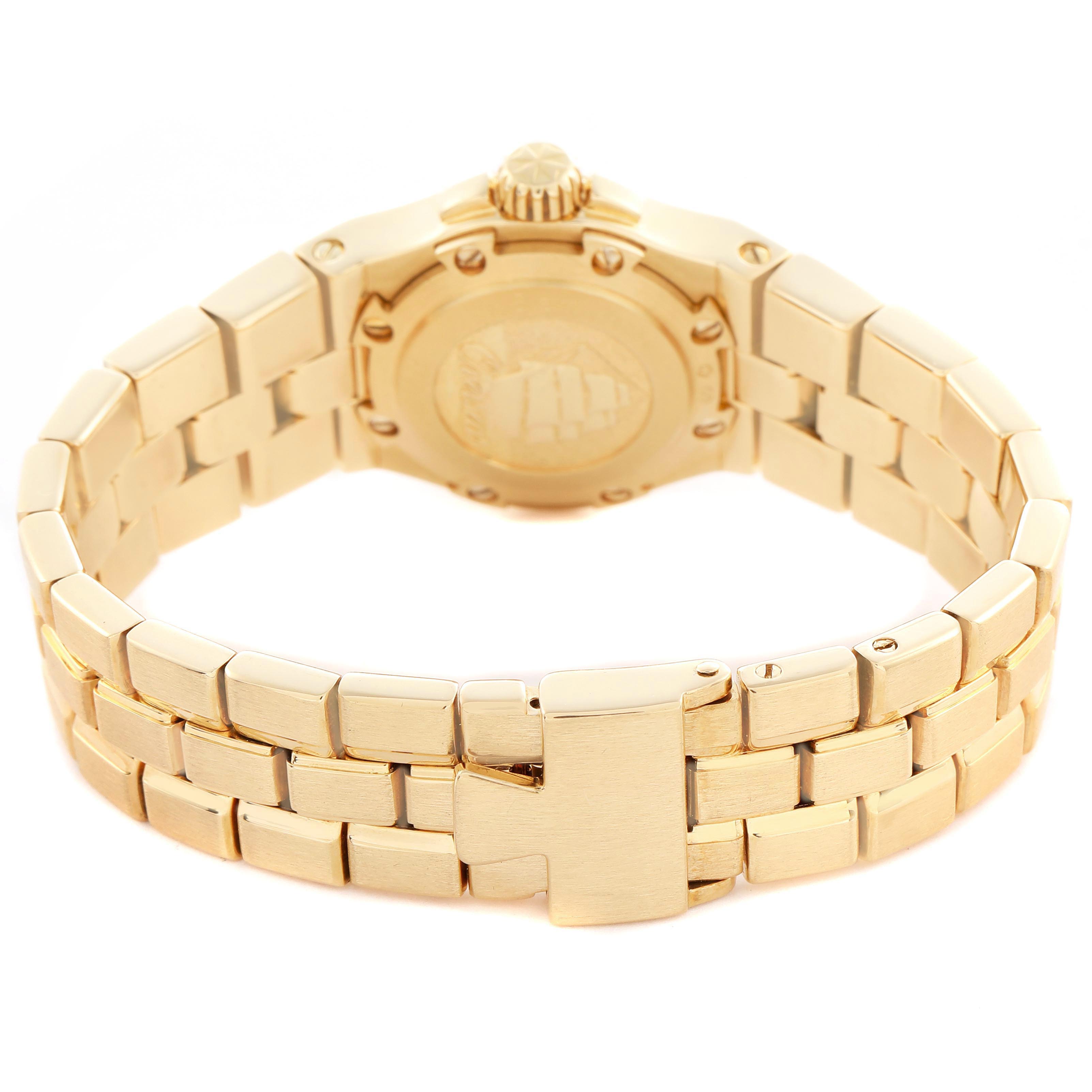 The Vacheron Constantin Overseas 16550.423J Women's Yellow Gold Silver Dial 16550.423J Women's Yellow Gold Silver Dial model is shown from the back, highlighting its caseback and metal bracelet clasp.