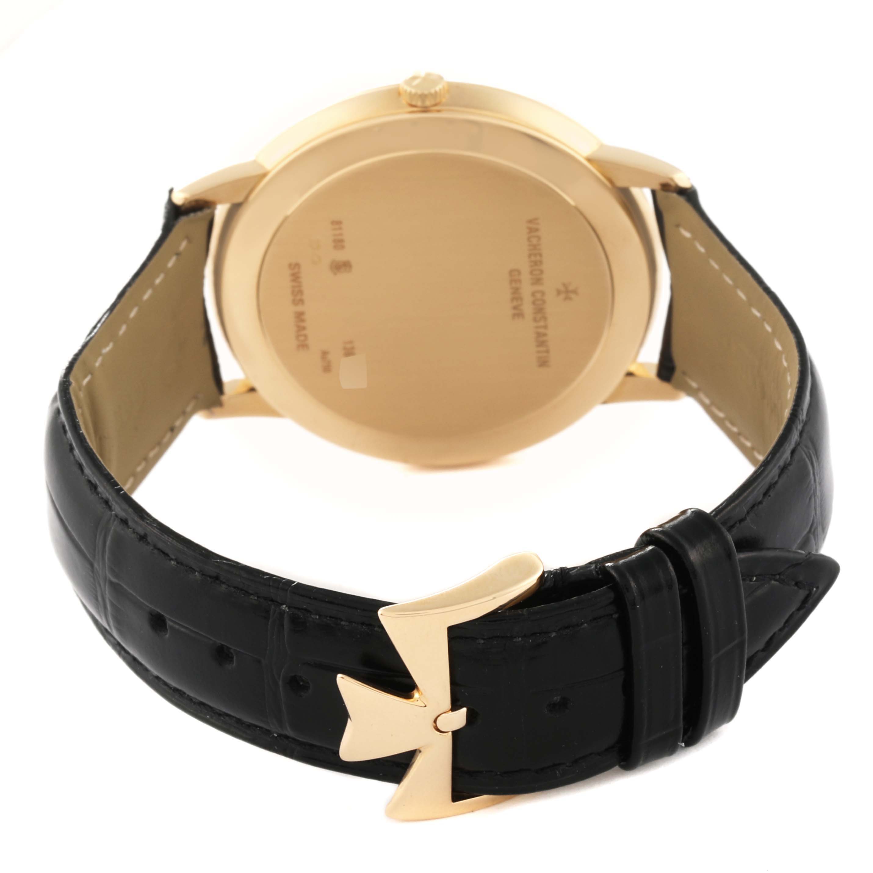 The image shows the back and strap of a Vacheron Constantin Patrimony 81180/000J Men's Yellow Gold Silver Dial 81180/000J Men's Yellow Gold Silver Dial watch, including its branded clasp and case back.