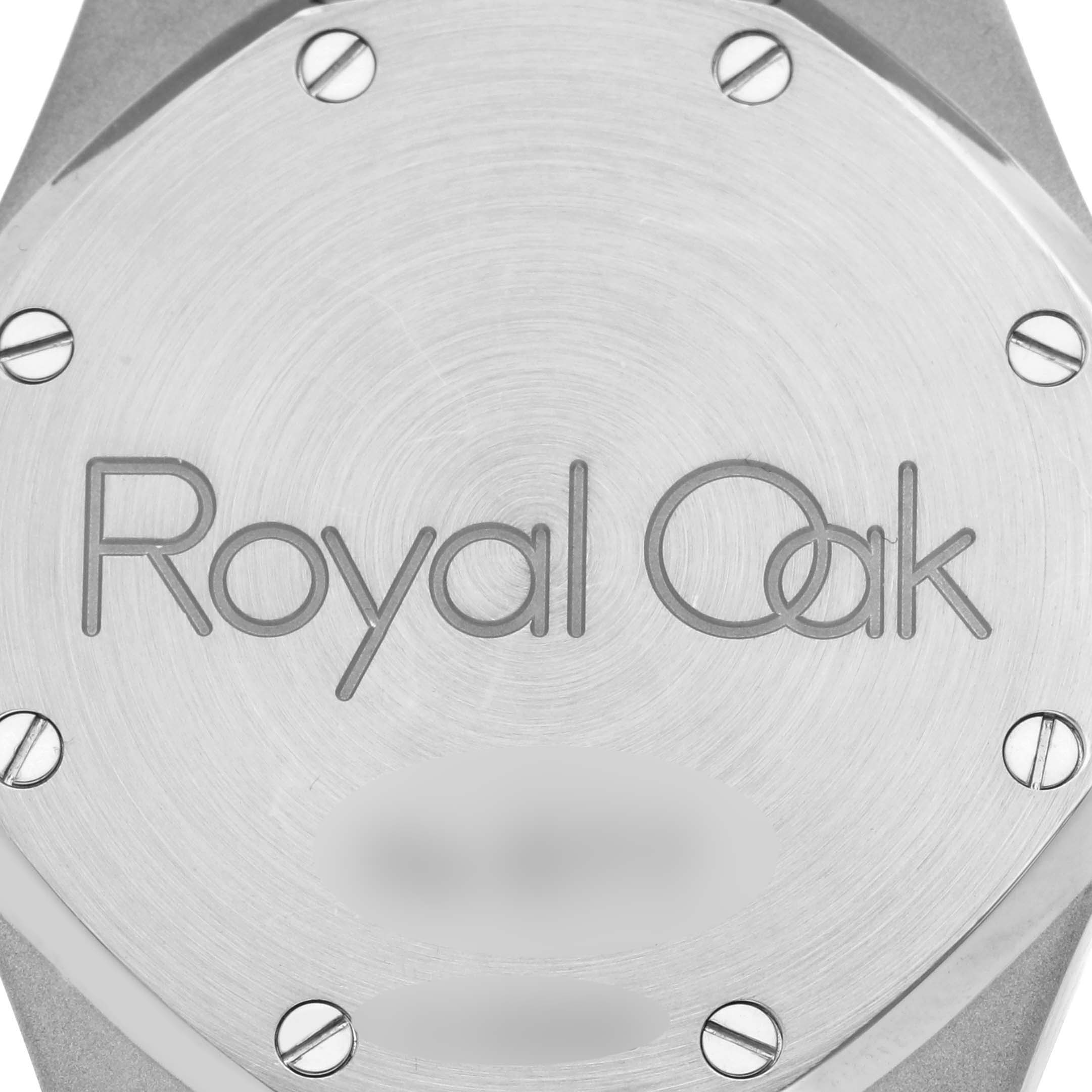 The image shows the back case of an Audemars Piguet Royal Oak 25730ST.O.0789ST.02 Men's Stainless Steel Black Dial 25730ST.O.0789ST.02 Men's Stainless Steel Black Dial watch from a top-down angle, highlighting its screws and engraving.