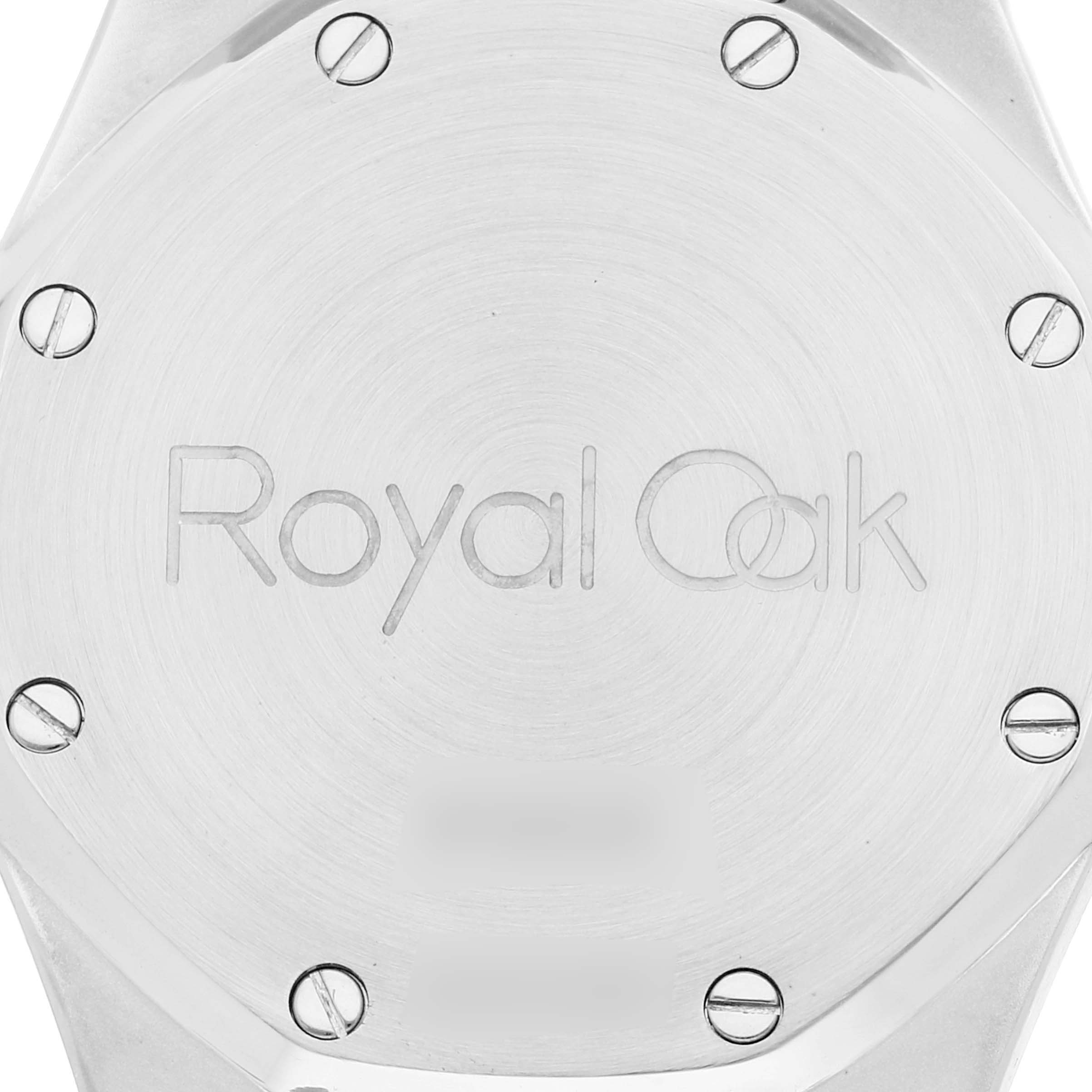 This image shows the back case of a Royal Oak watch by Audemars Piguet, featuring the brand
s engraving and screws.