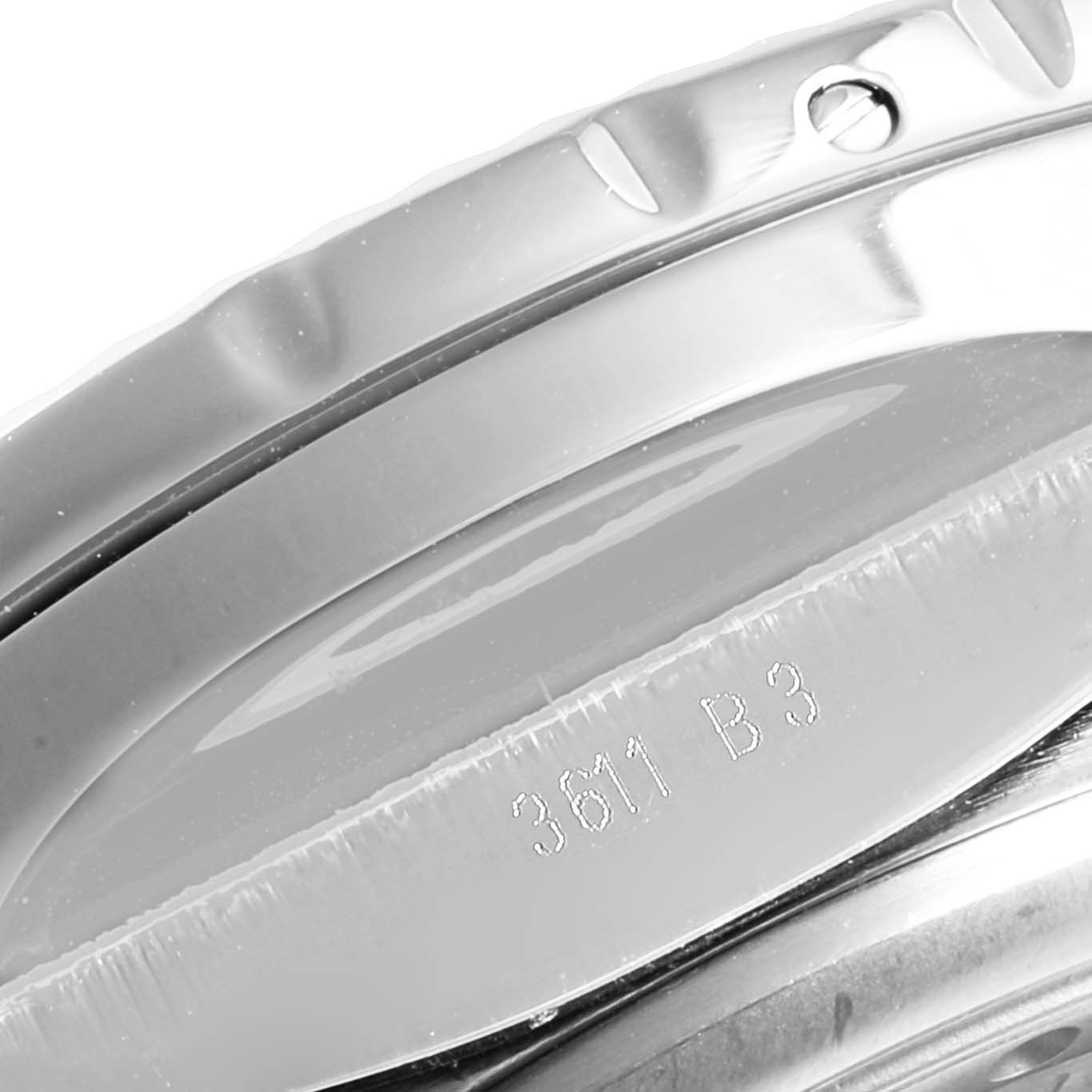 This image shows a close-up of the side and bezel of a Bentley model by Breitling, highlighting its metallic finish and a part number engraving.