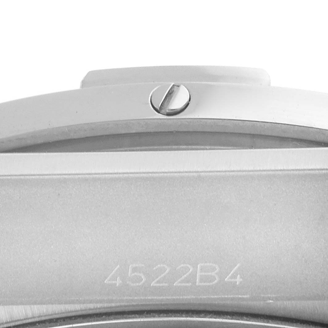 The image shows a close-up of the side view of a Breitling Chronomat PB0134101C1S1 Men's Stainless Steel Blue Dial PB0134101C1S1 Men's Stainless Steel Blue Dial watch, focusing on the case and bezel with a screw and model engraving.