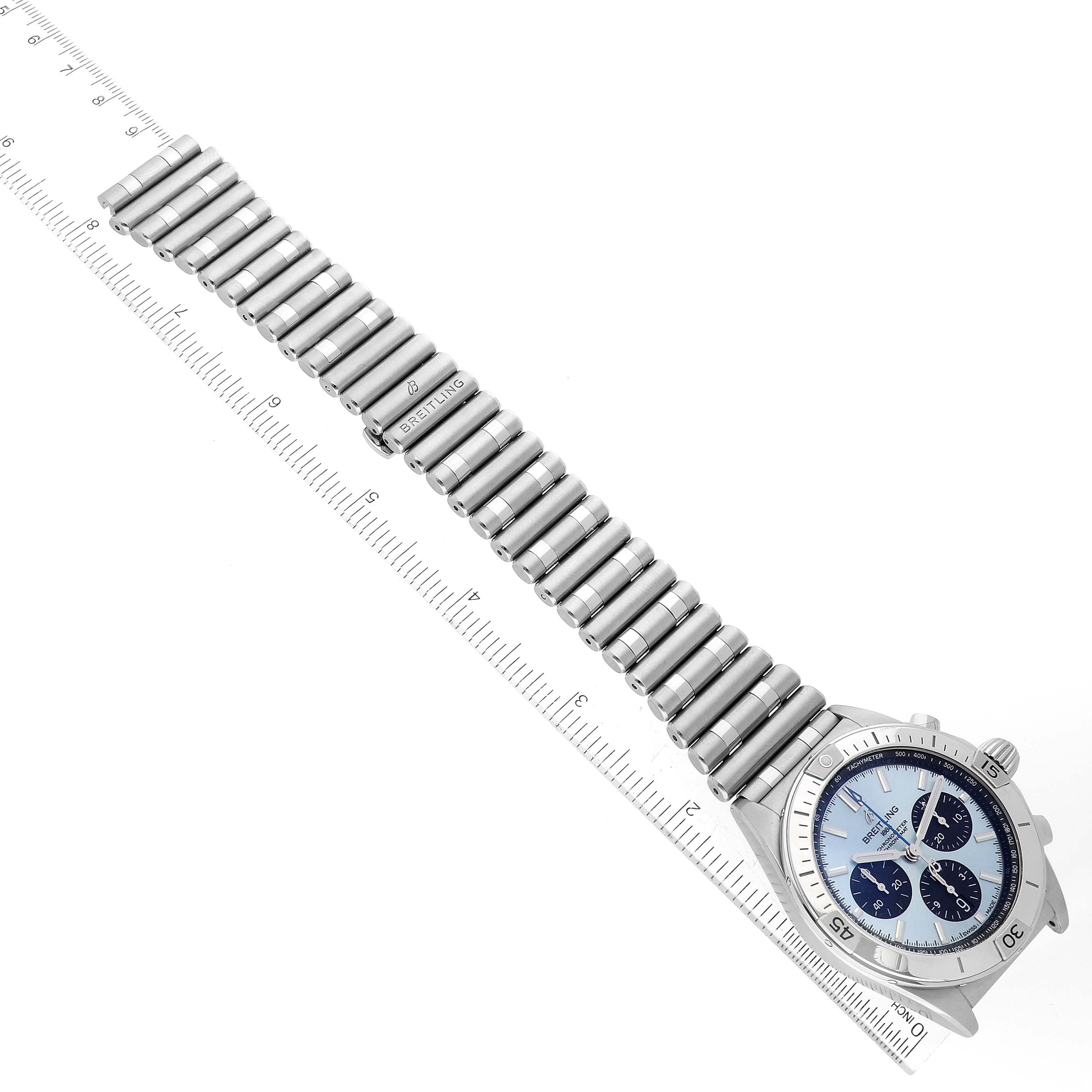 The image shows a top-down view of a Breitling Chronomat PB0134101C1S1 Men's Stainless Steel Blue Dial PB0134101C1S1 Men's Stainless Steel Blue Dial watch, displaying the face, bezel, and metal bracelet alongside a ruler.