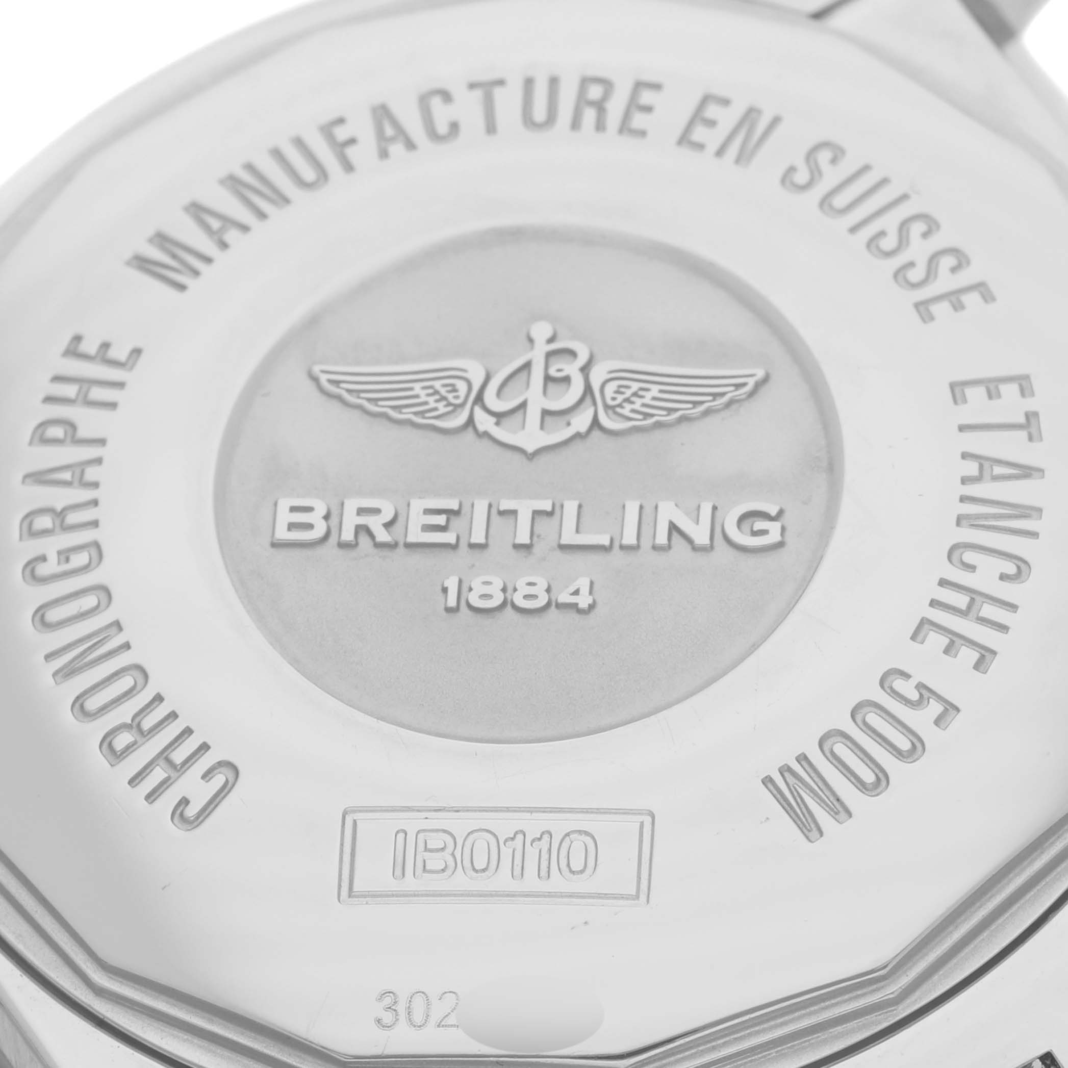 The image shows the back casing of a Breitling Chronomat IB0110 Men's Steel and Gold (two tone) Black Dial IB0110 Men's Steel and Gold (two tone) Black Dial, highlighting branding and model details.