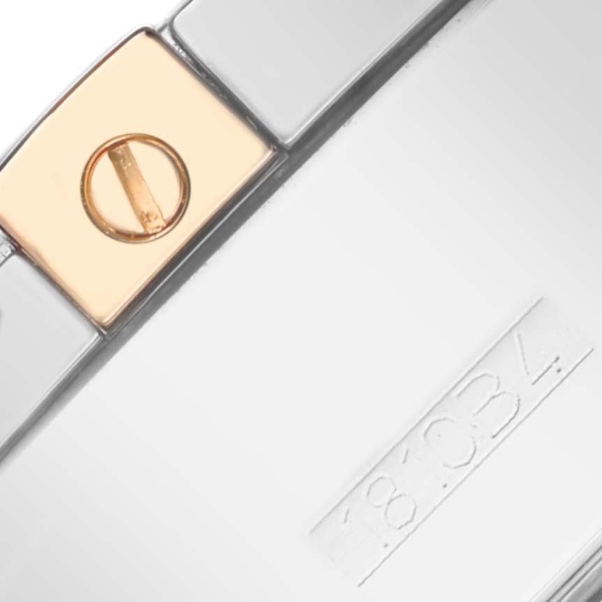 The image shows a close-up of the bracelet clasp and links of a Breitling Chronomat IB0110 Men's Steel and Gold (two tone) Black Dial IB0110 Men's Steel and Gold (two tone) Black Dial watch, highlighting a screw and engraved serial number.