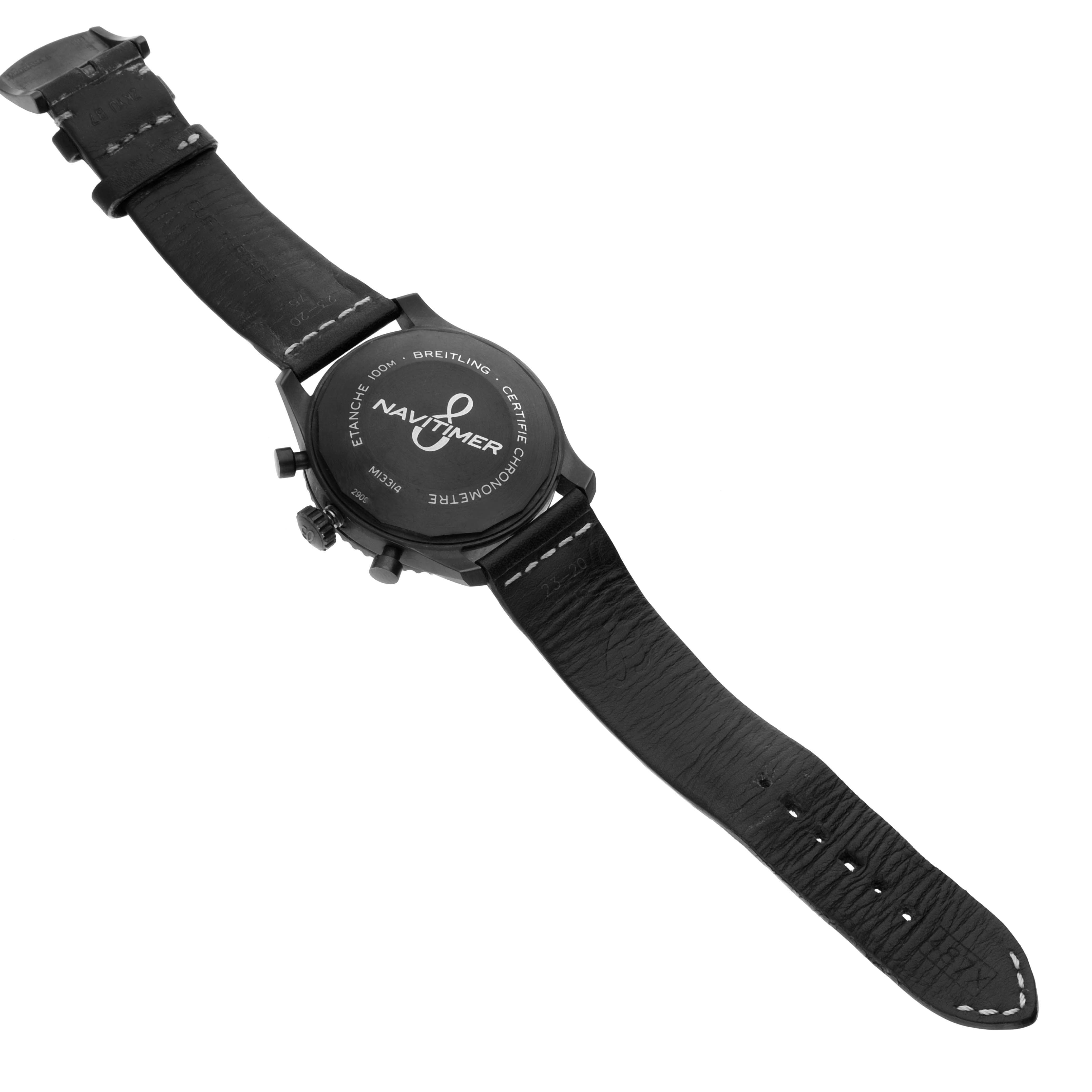 The image shows the back of a Breitling Navitimer M13314101B1X1 Men's Stainless Steel Black Dial watch, displaying the case back and the full leather strap.