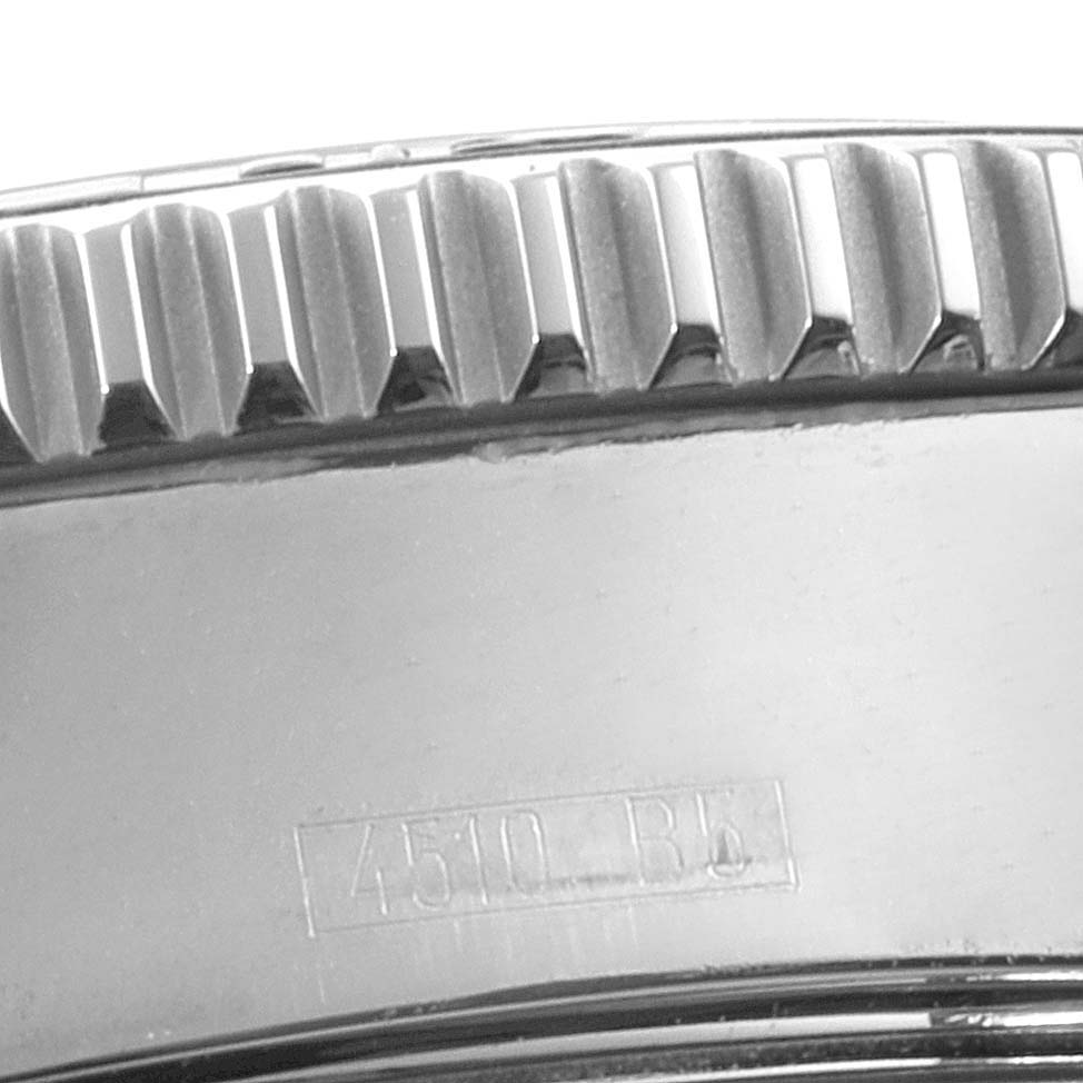This close-up image shows the bezel and part of the case of a Breitling Superocean A17364 Men's Stainless Steel Black Dial A17364 Men's Stainless Steel Black Dial watch.