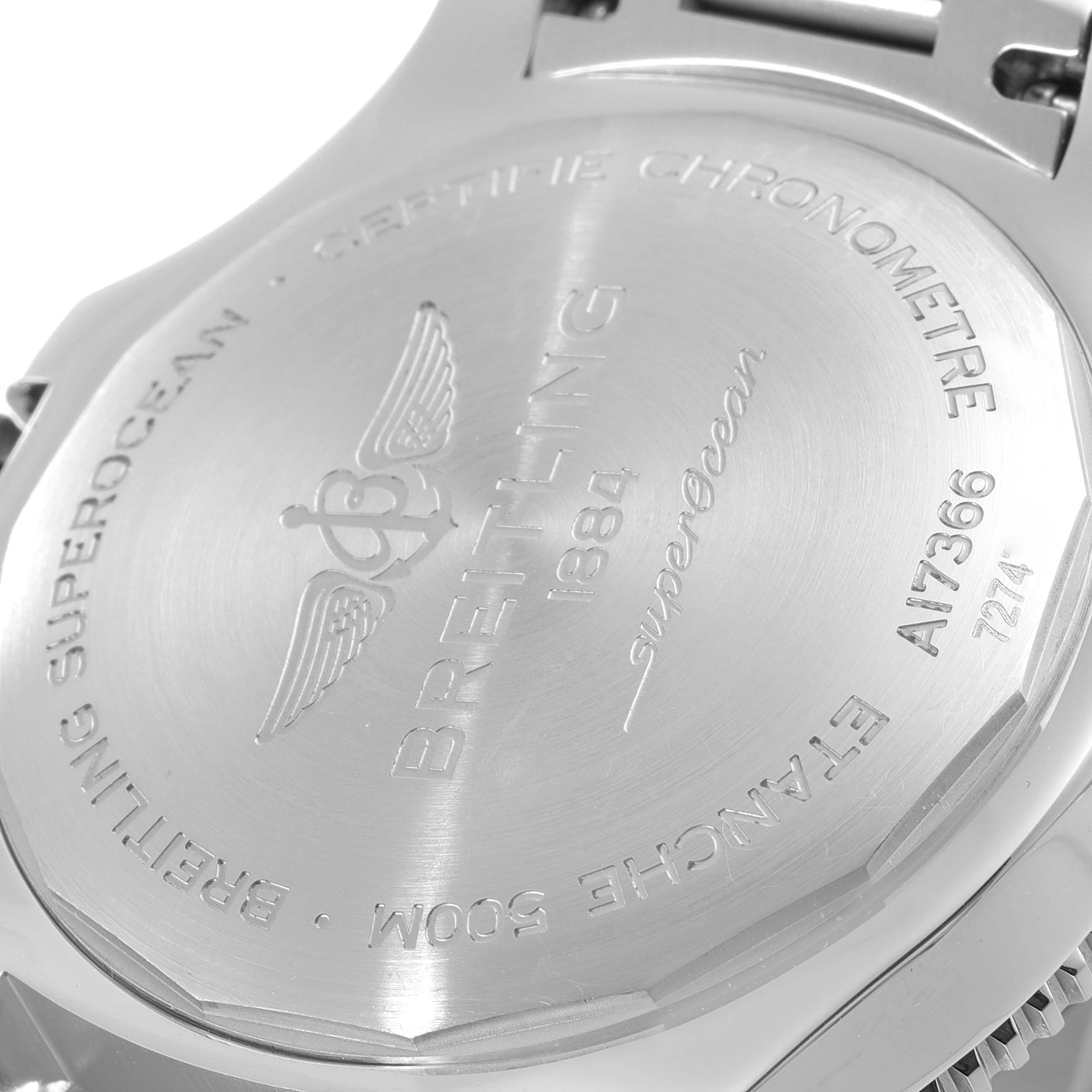 This image shows the back case of a Breitling Superocean A17366 Men's Stainless Steel Black Dial A17366 Men's Stainless Steel Black Dial watch at an angled view, highlighting its engravings.
