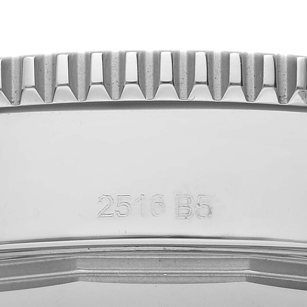 The image shows a close-up of the side of a Breitling Superocean A17365 Men's Stainless Steel Blue Dial A17365 Men's Stainless Steel Blue Dial watch, highlighting the bezel and a portion of the case with an engraved number.