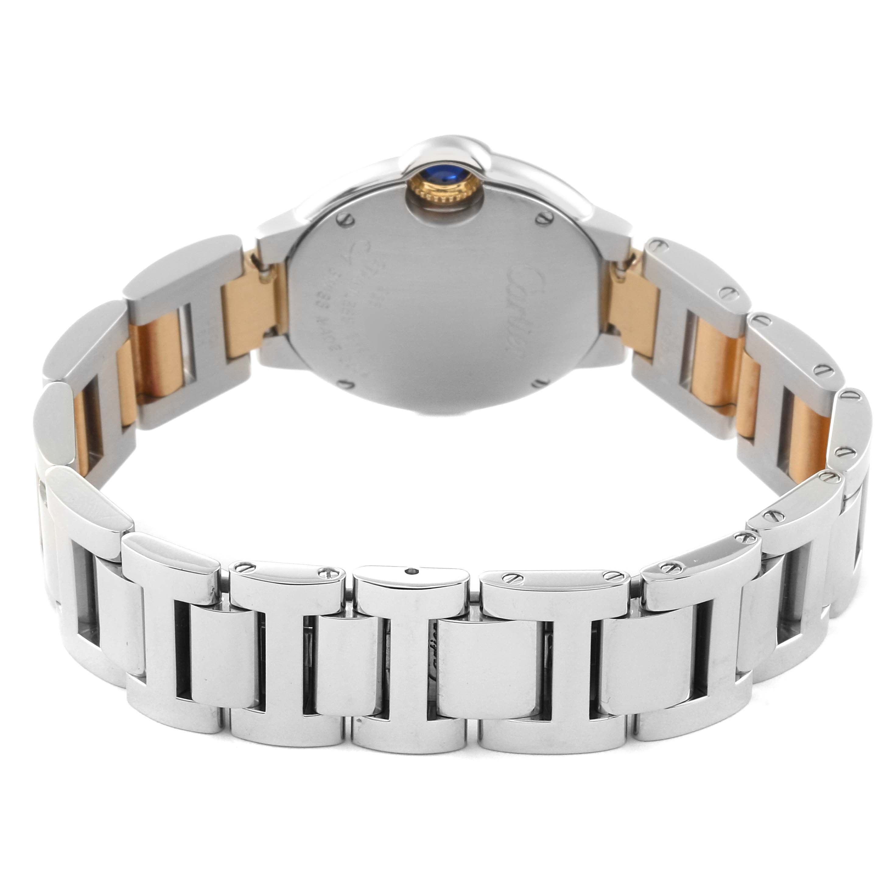 The image shows the back of a Ballon Bleu model by Cartier, highlighting its case back and bracelet.
