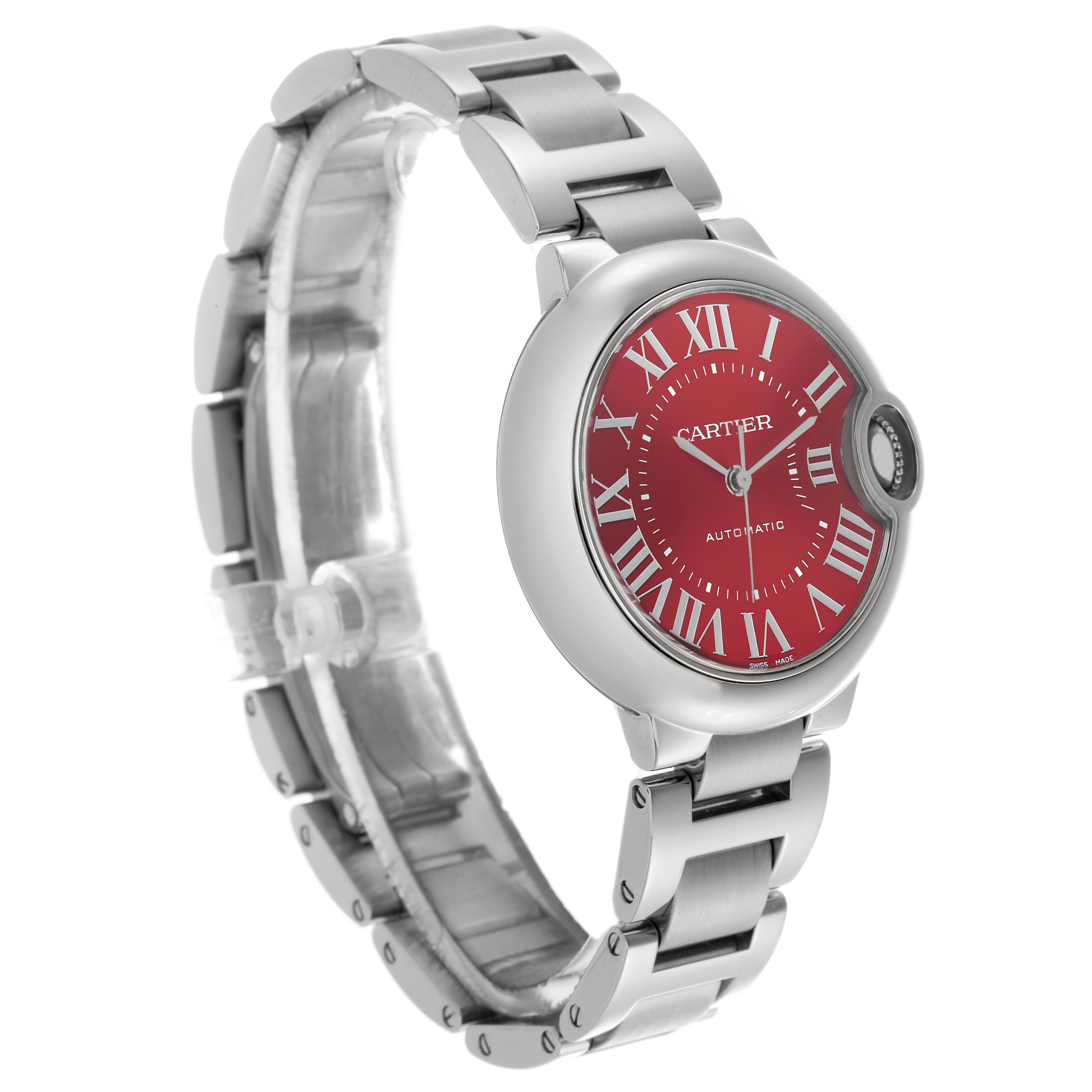 The Cartier Ballon Bleu WSBB0052 Women's Stainless Steel Red Dial WSBB0052 Women's Stainless Steel Red Dial watch is shown at a slight angle, highlighting the red dial, Roman numerals, and metal bracelet.