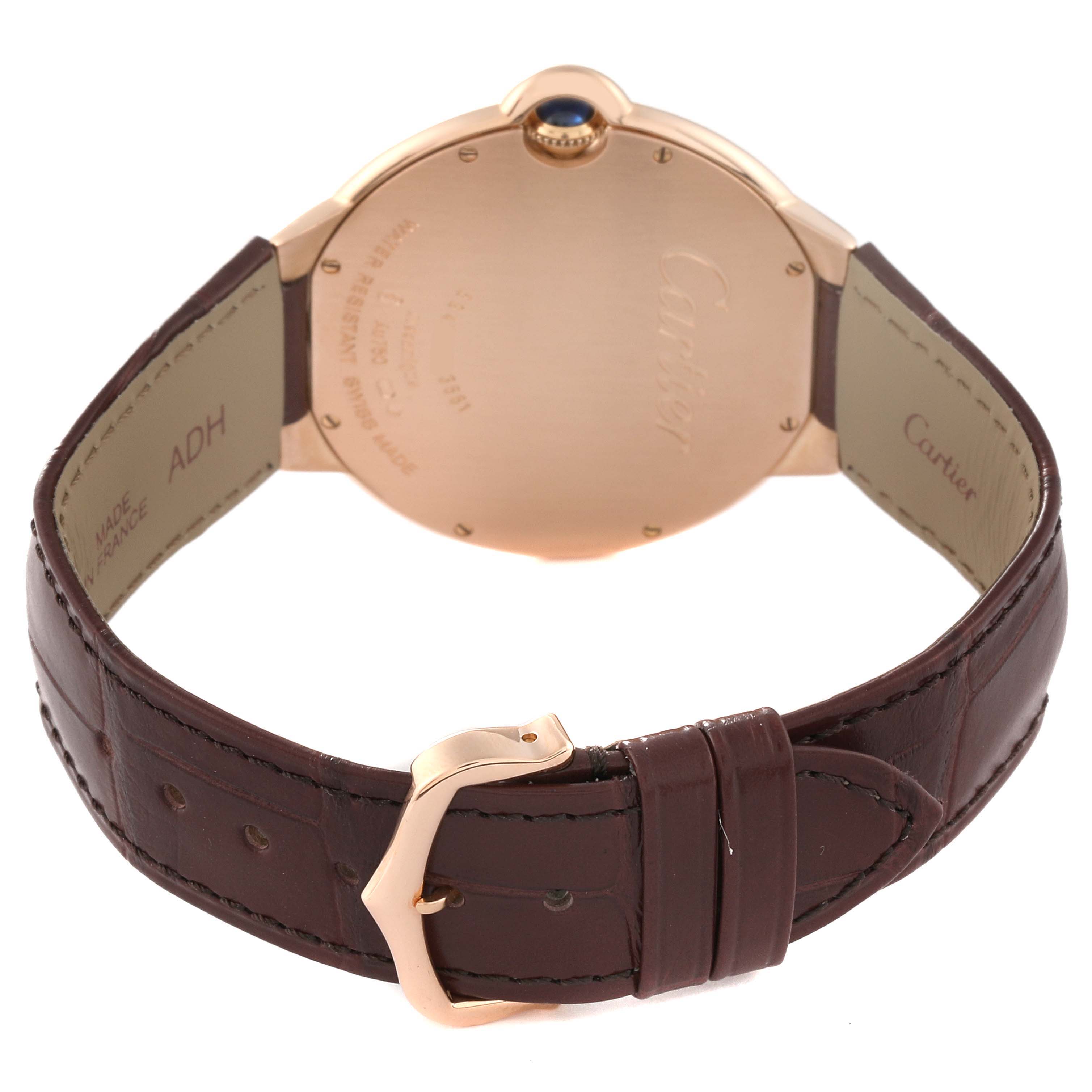 The image shows the back of the Cartier Ballon Bleu W6900651 Men's Rose Gold Silver Dial W6900651 Men's Rose Gold Silver Dial watch and the brown leather strap with a buckle clasp.