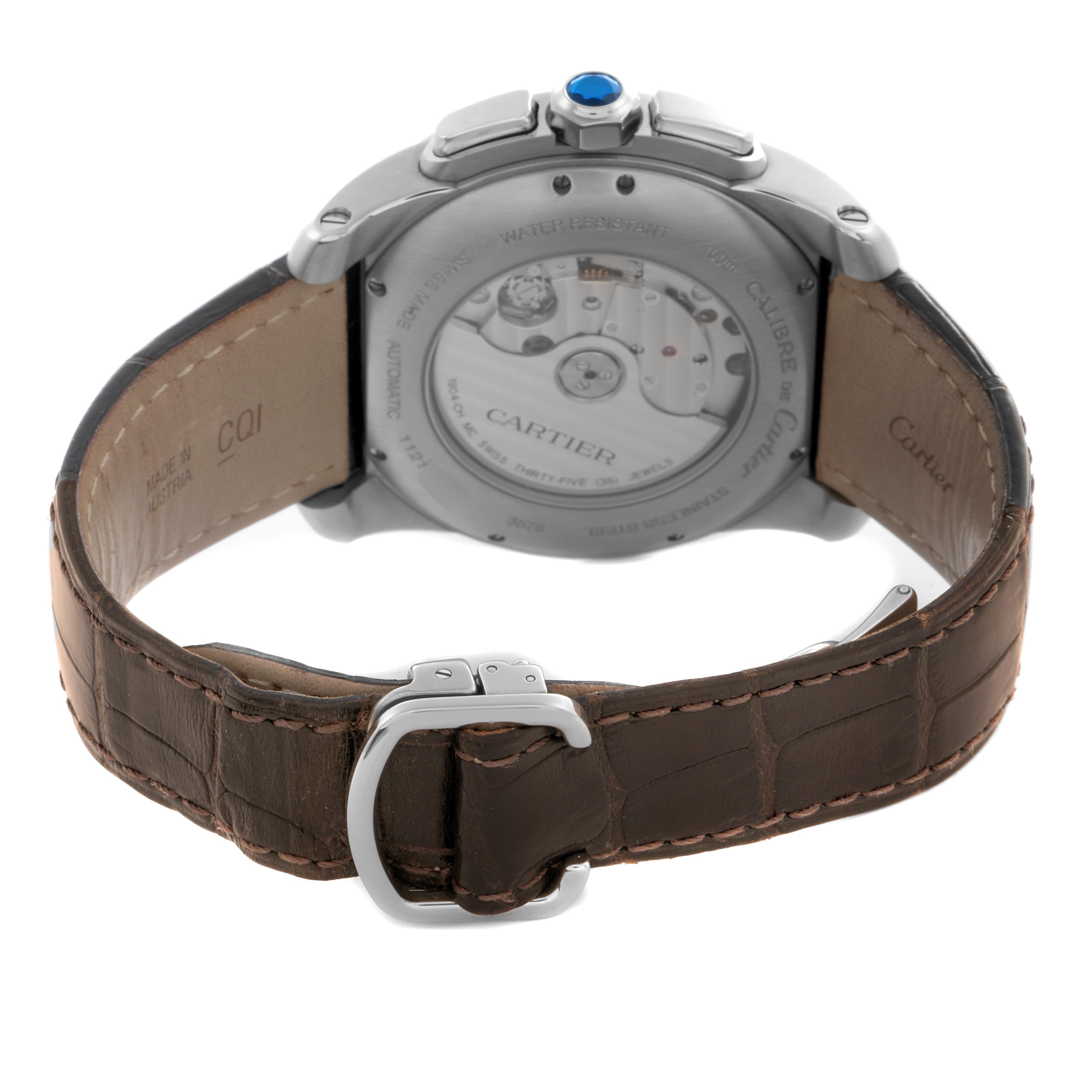 The image shows the back of the Calibre de Cartier watch, highlighting the transparent case back and leather strap.