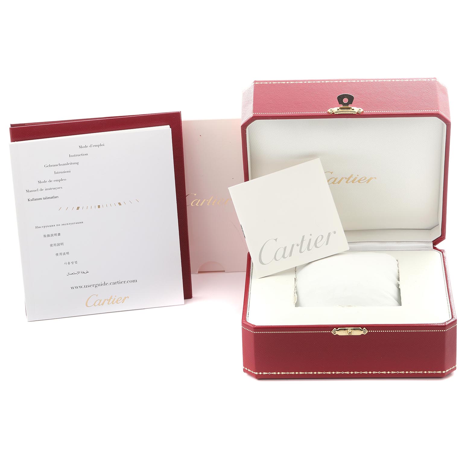 The image shows a Calibre de Cartier watch box, documents, and manuals with the Cartier branding.